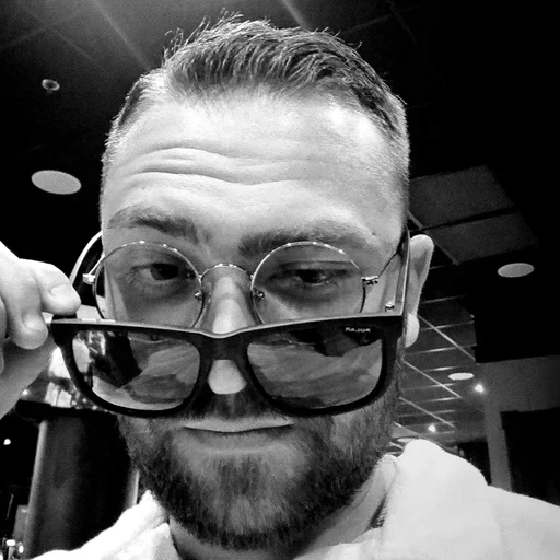 Simon Kamali wearing two glasses