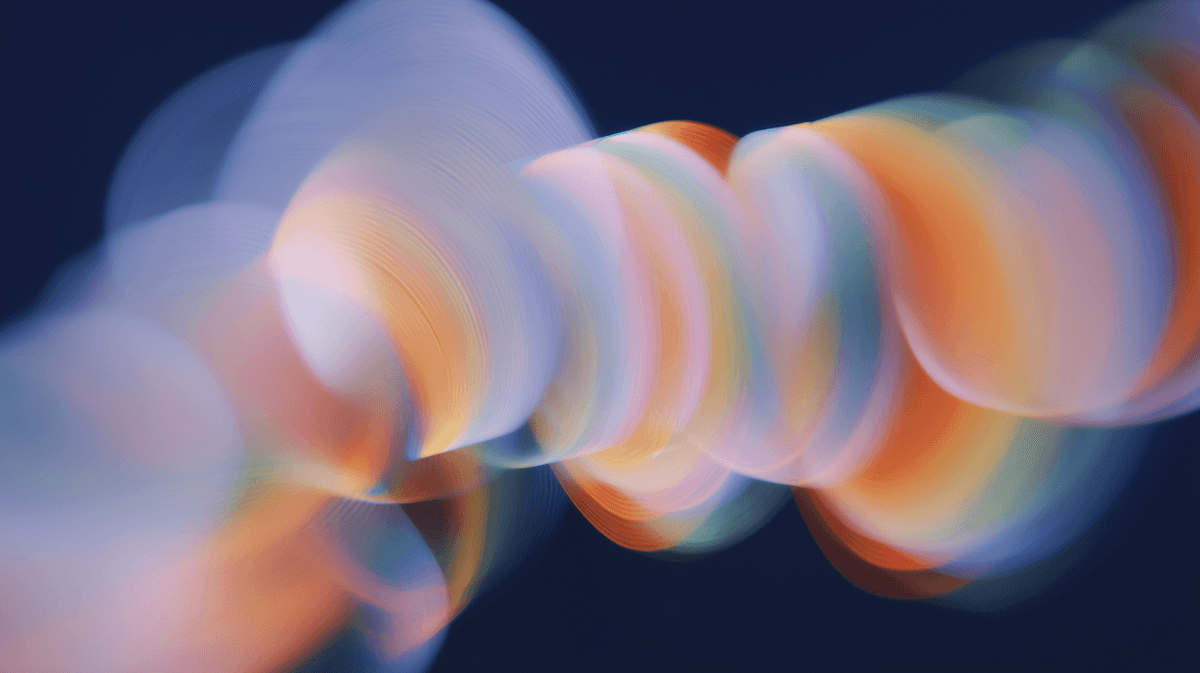 Abstract image of red light trails on a dark background.