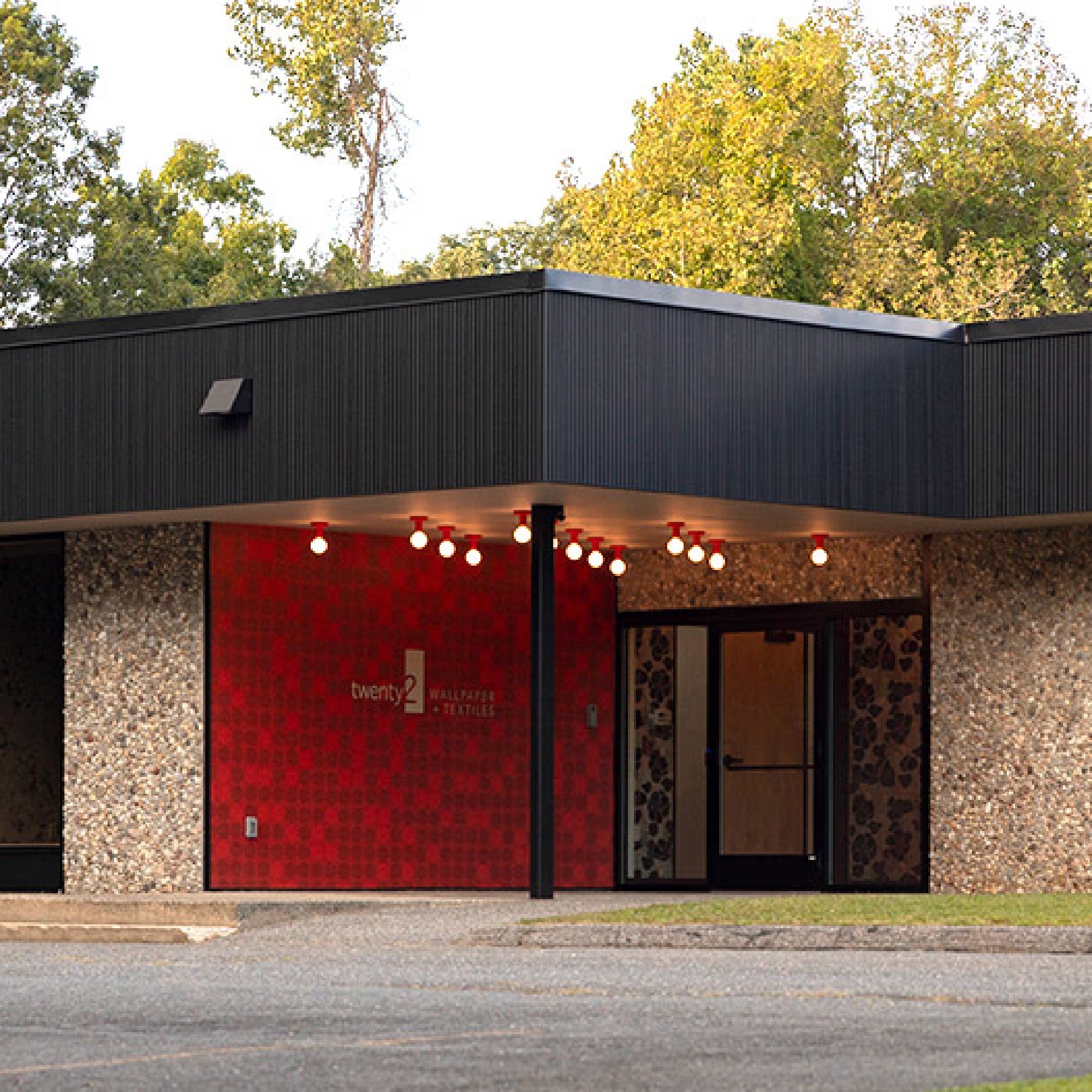 Front door of twenty two factory, with bold red mural installed.