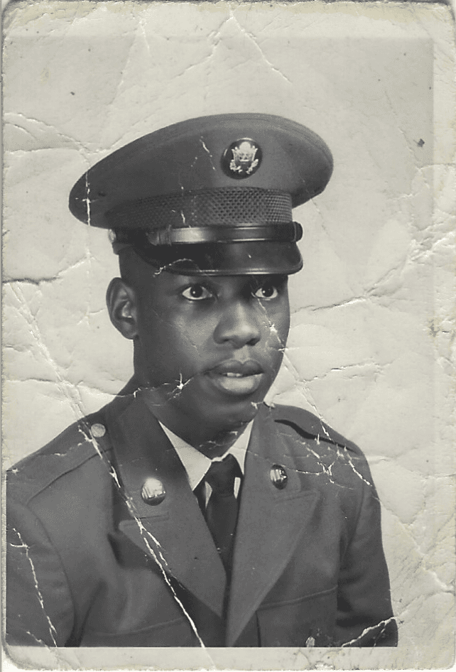 an old black and white photo of Angela's father wearing an army suit and cap.
