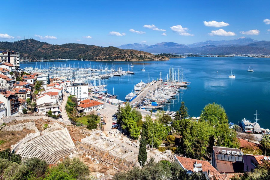 Fethiye Marina aerial view – yachts, piers, and coastal landscape in the Mediterranean.