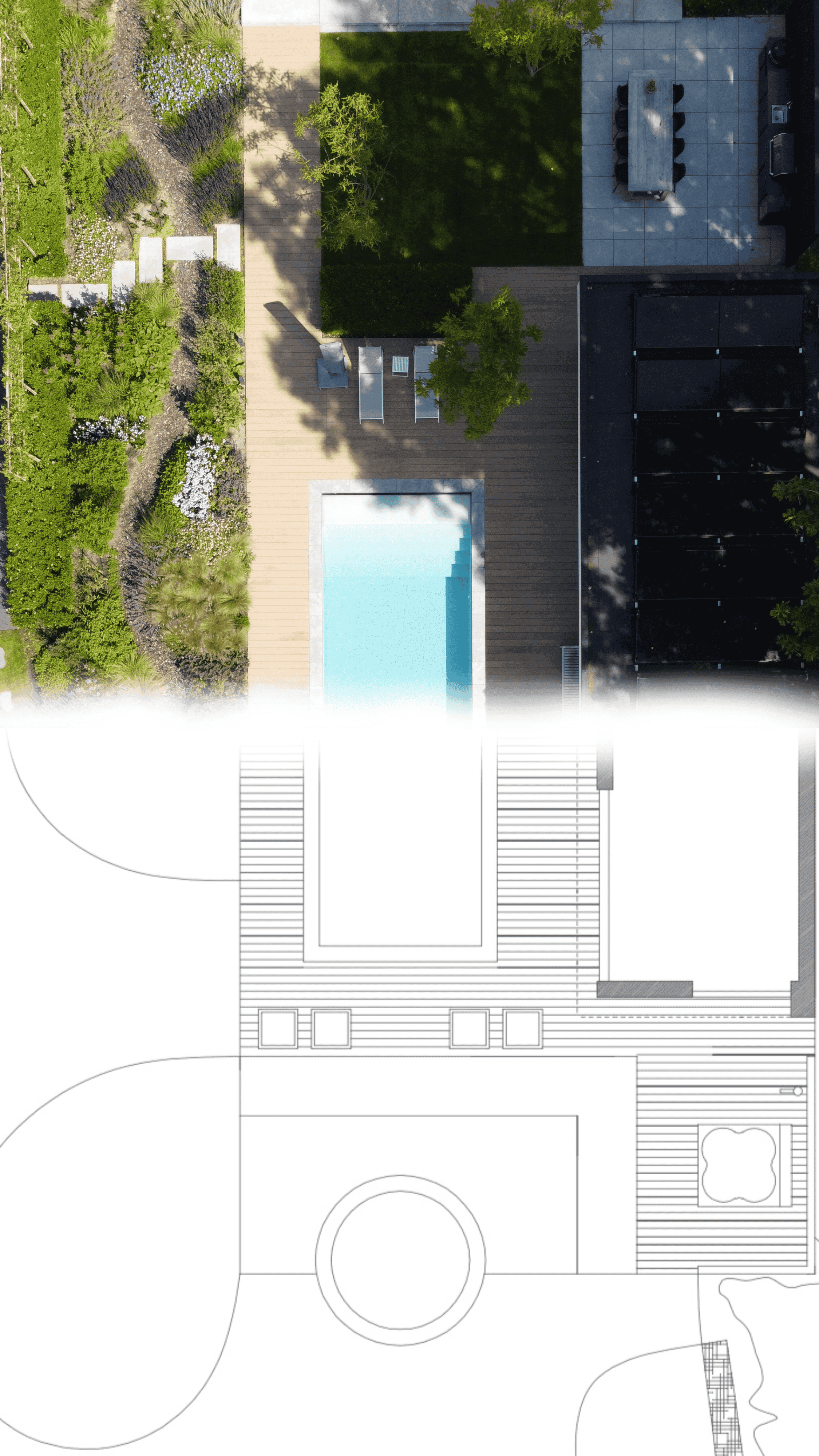 A serene outdoor seating area with two chairs, surrounded by lush greenery and a glassed-in structure.