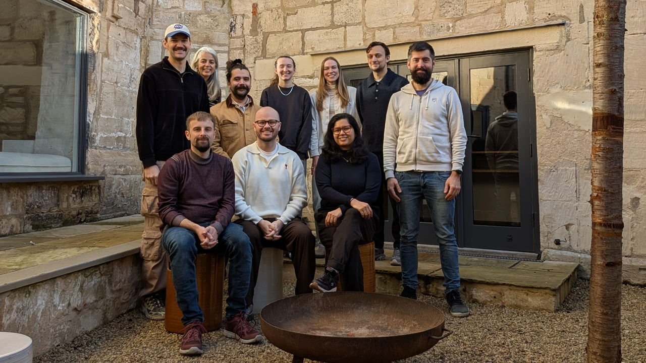 Three founders standing in a industrial building