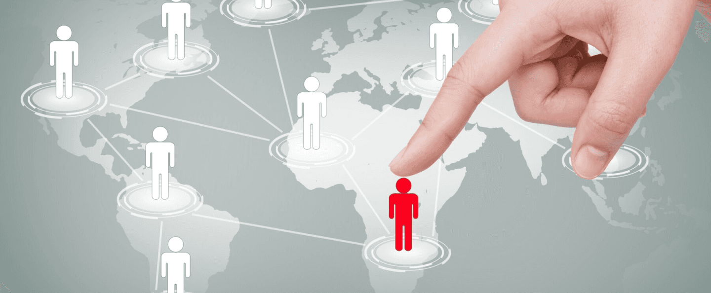 Customer segmentation in a mobile app: A finger points to a red-highlighted figure on a world map of interconnected customers