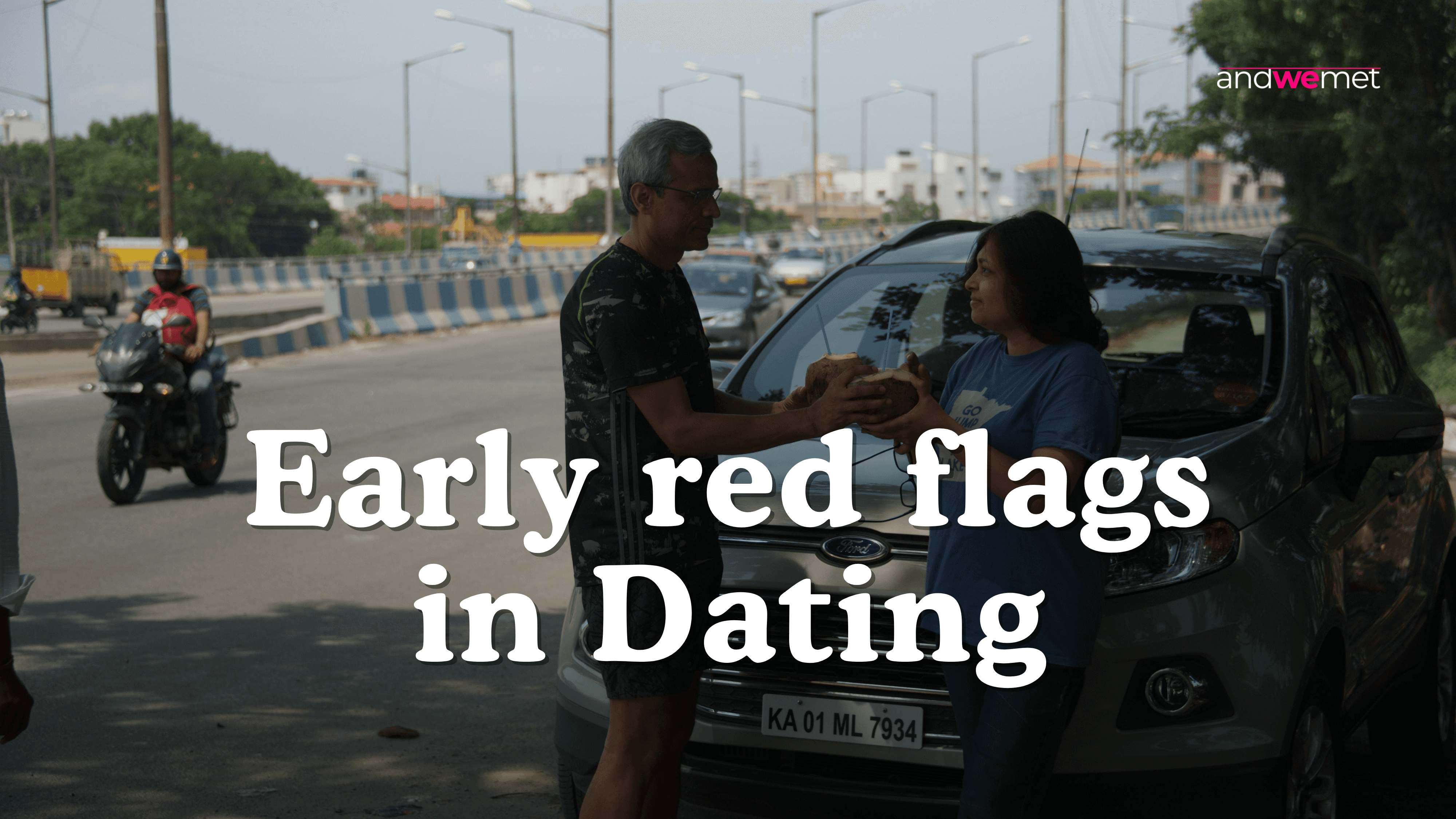 Couple having tense conversation by car on street representing early dating warning signs and red flags - andwemet relationship advice
