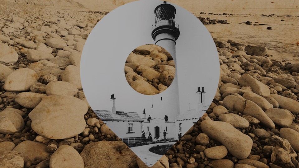 A sepia image of rocks buy the sea and a pin icon with a black and white image of a lighthouse