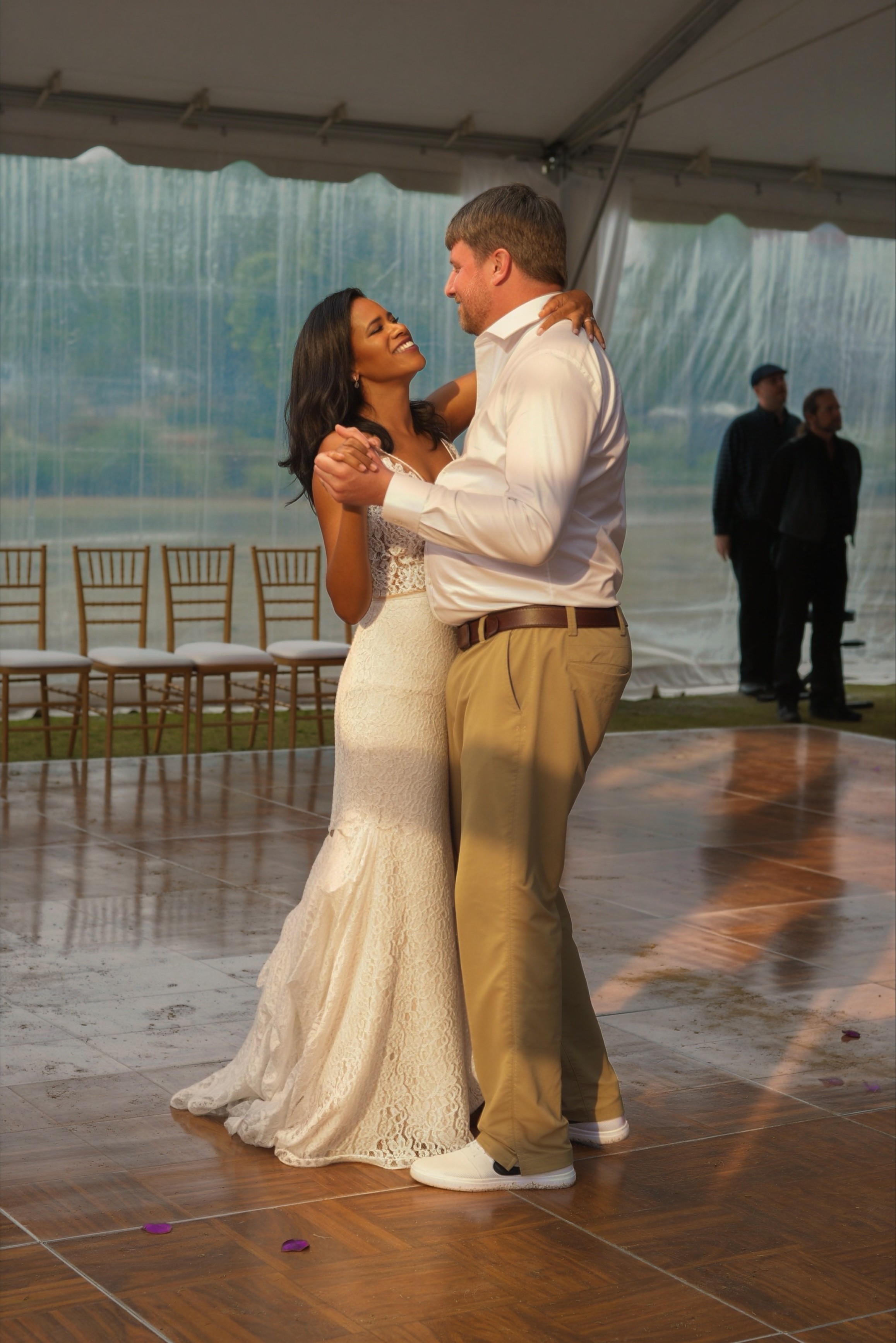 Bride and groom share their first dance in a tented reception at golden hour — Atlanta wedding photographer