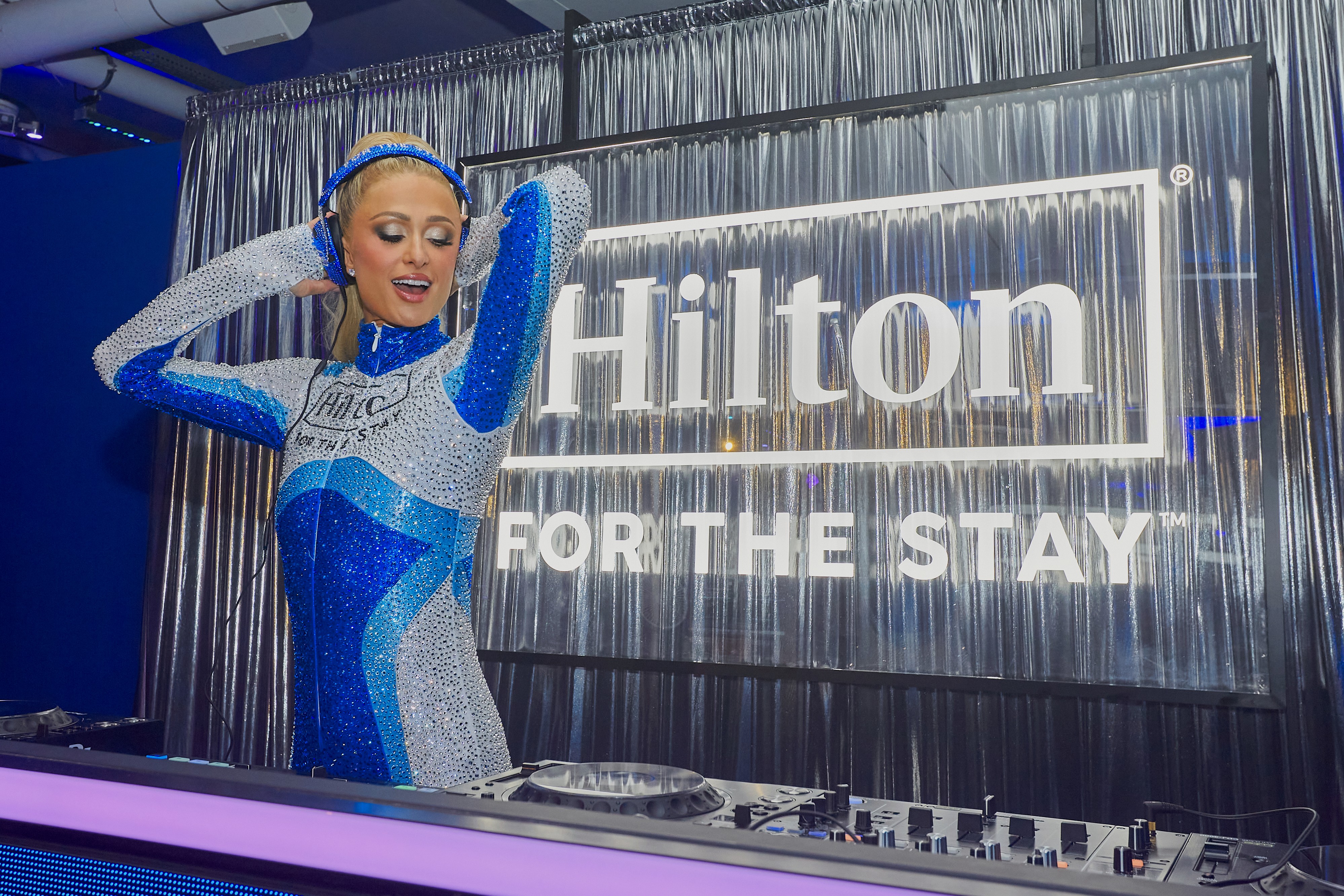two men riding motocross bikes on brown sand