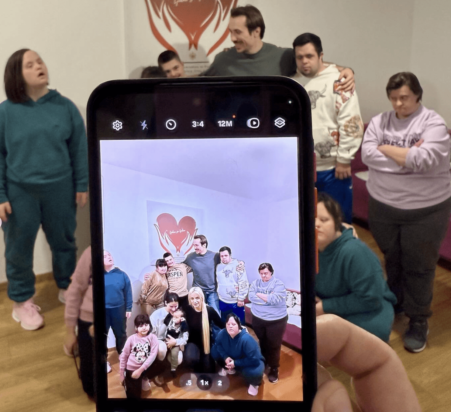 phone taking picture the group of people