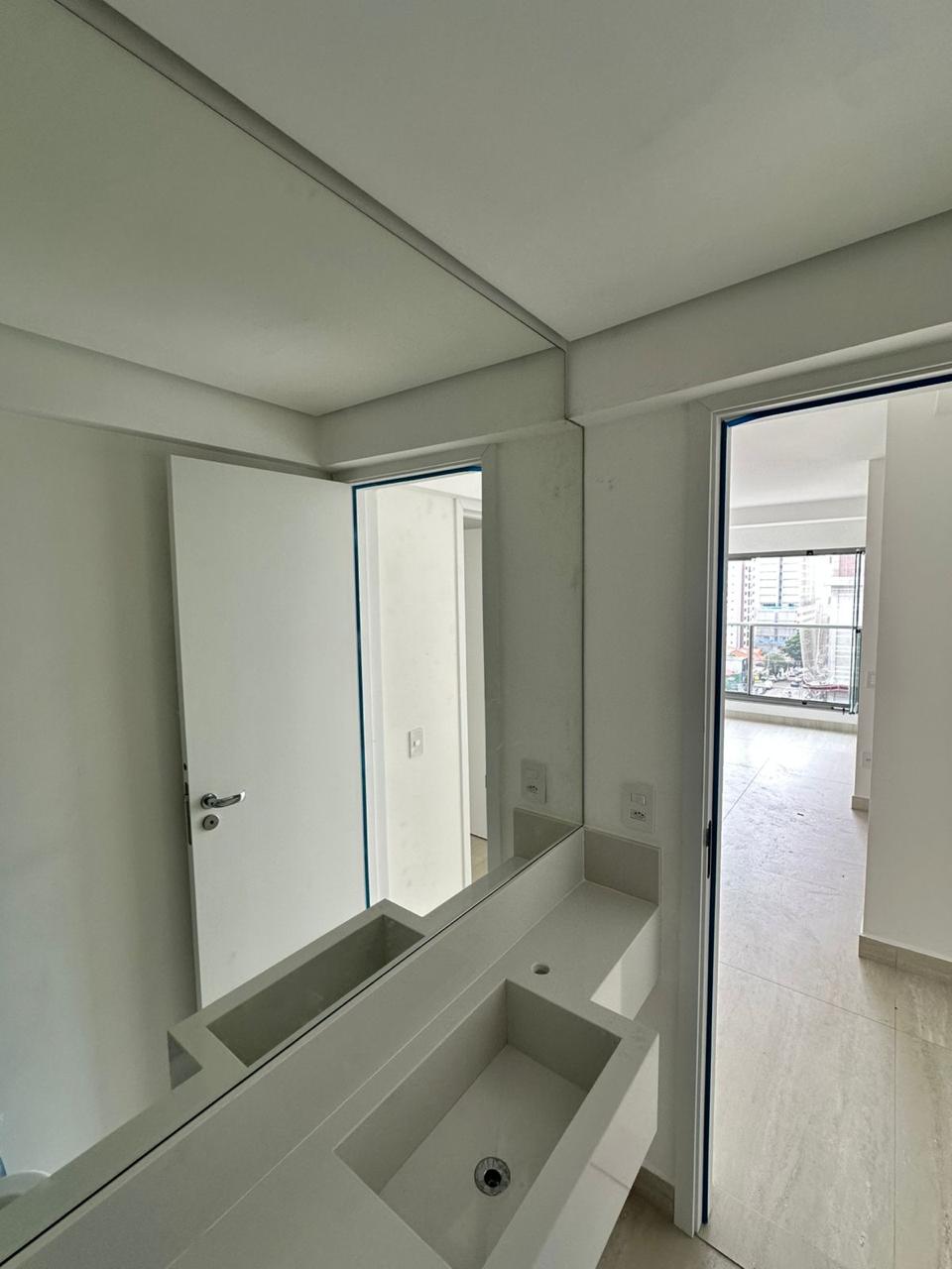 man wearing gray polo shirt beside dry-erase board