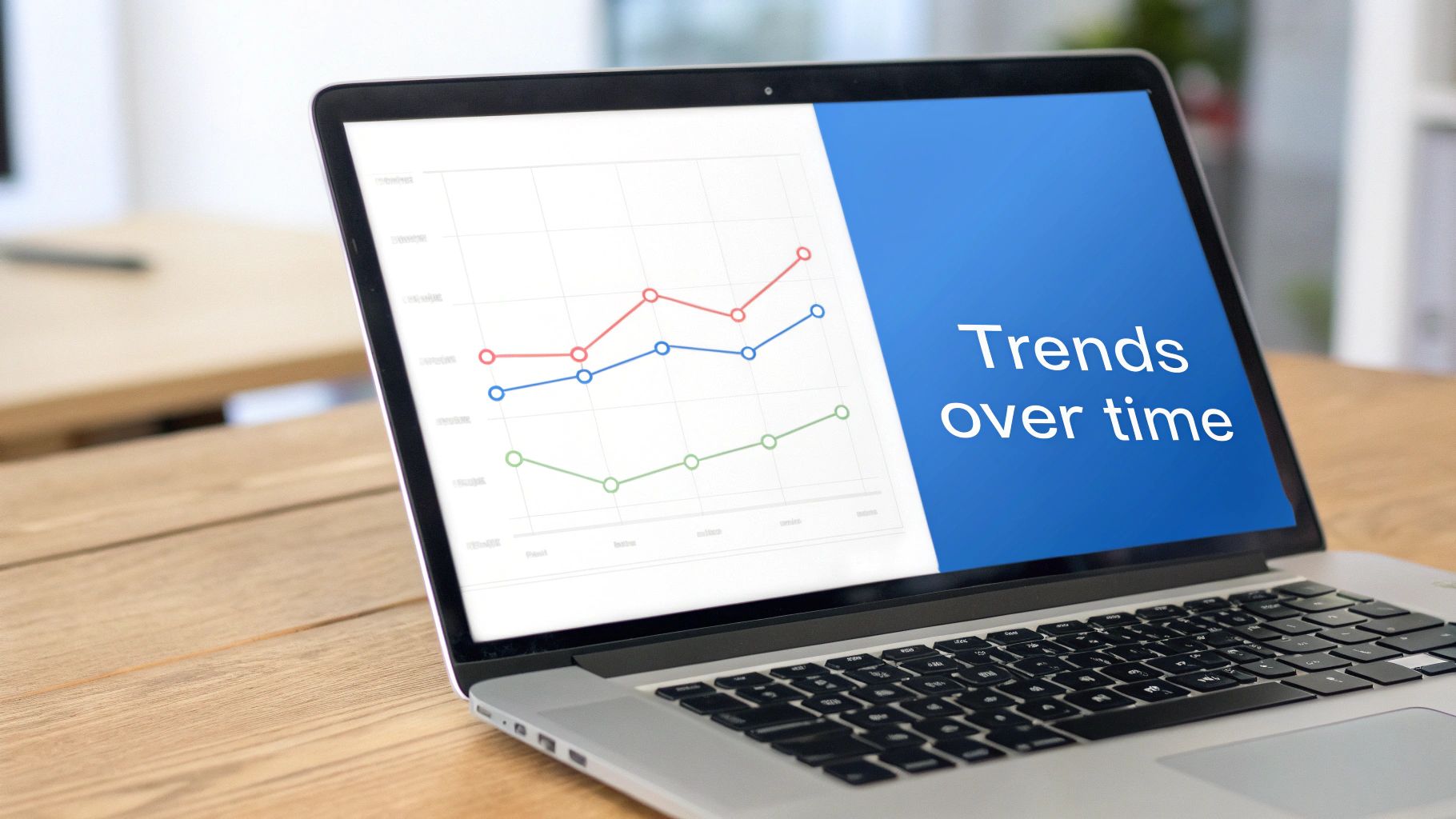 A laptop screen displays a line graph on the left and “Trends over time” text on a blue background.