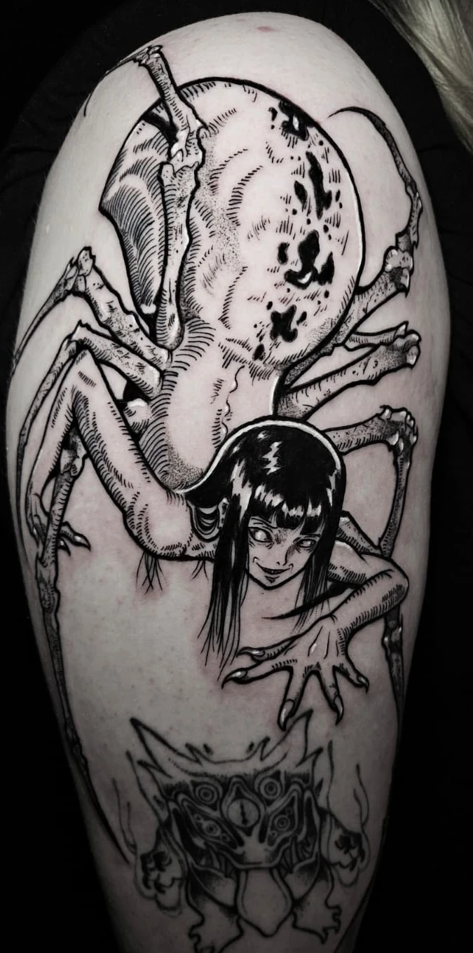 Manga horror upper-arm tattoo by Alberto