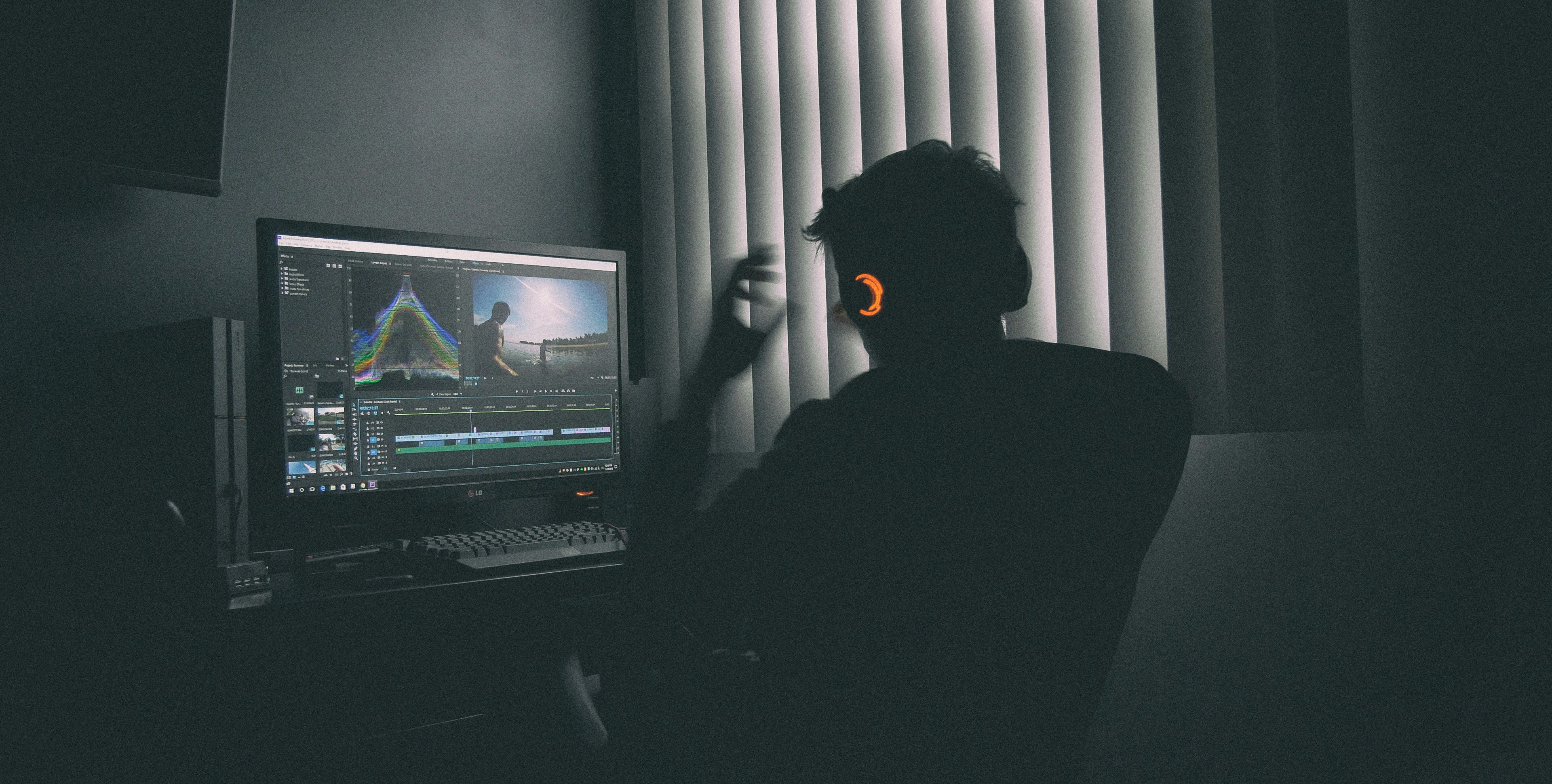 man editing video and sound - xtrax stems