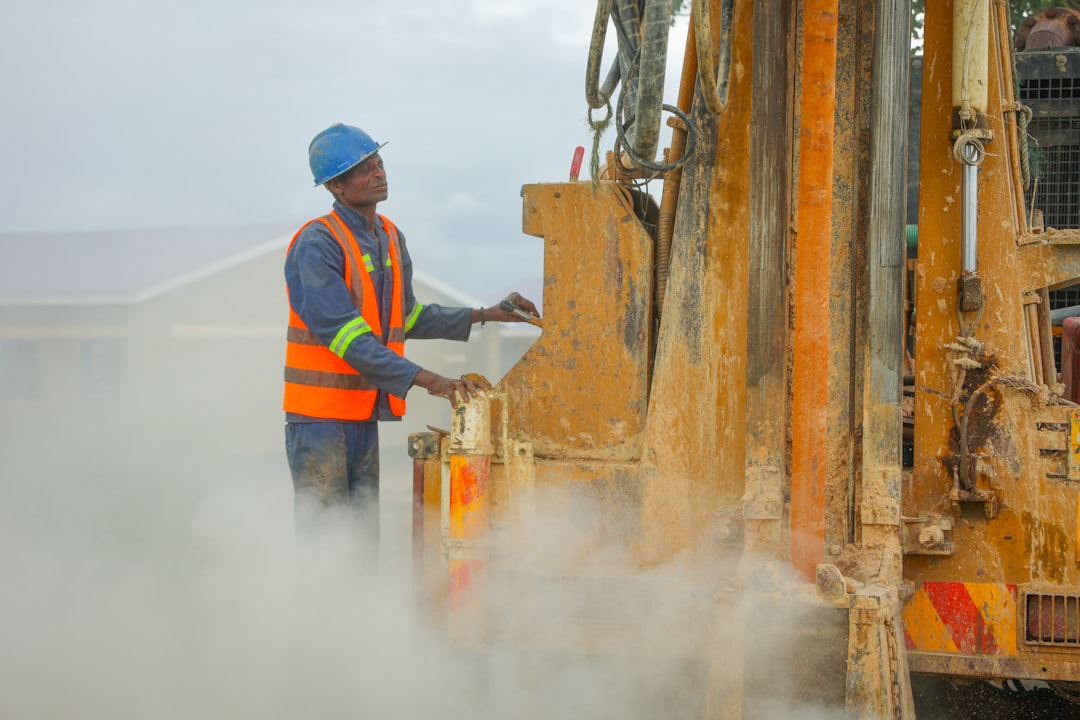 A compact utility HDD rig performing a precision bore in an urban environment