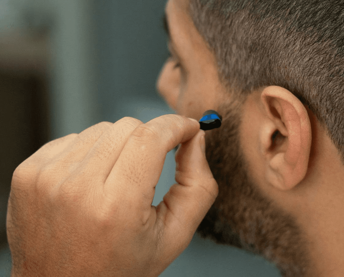 person wearing silver framed eyeglasses