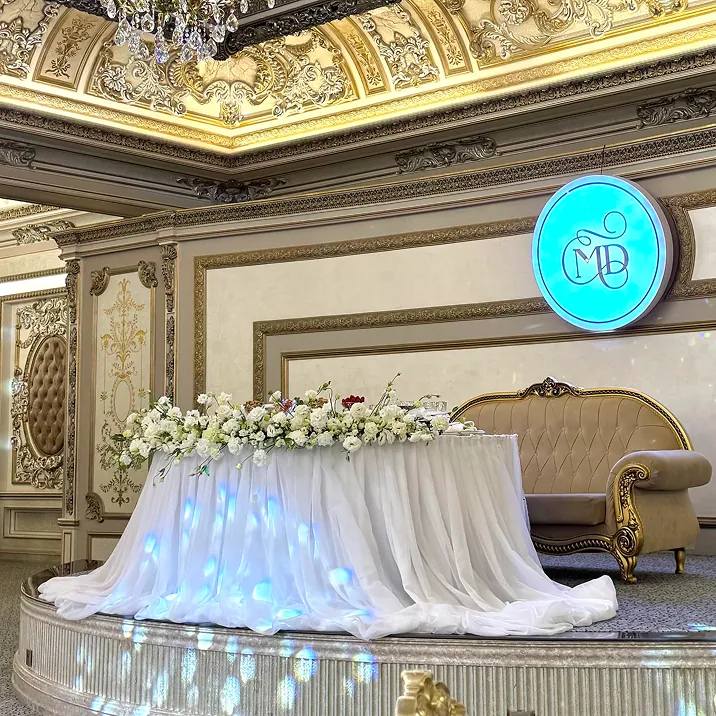 Luxurious wedding stage with floral decor and gold accents