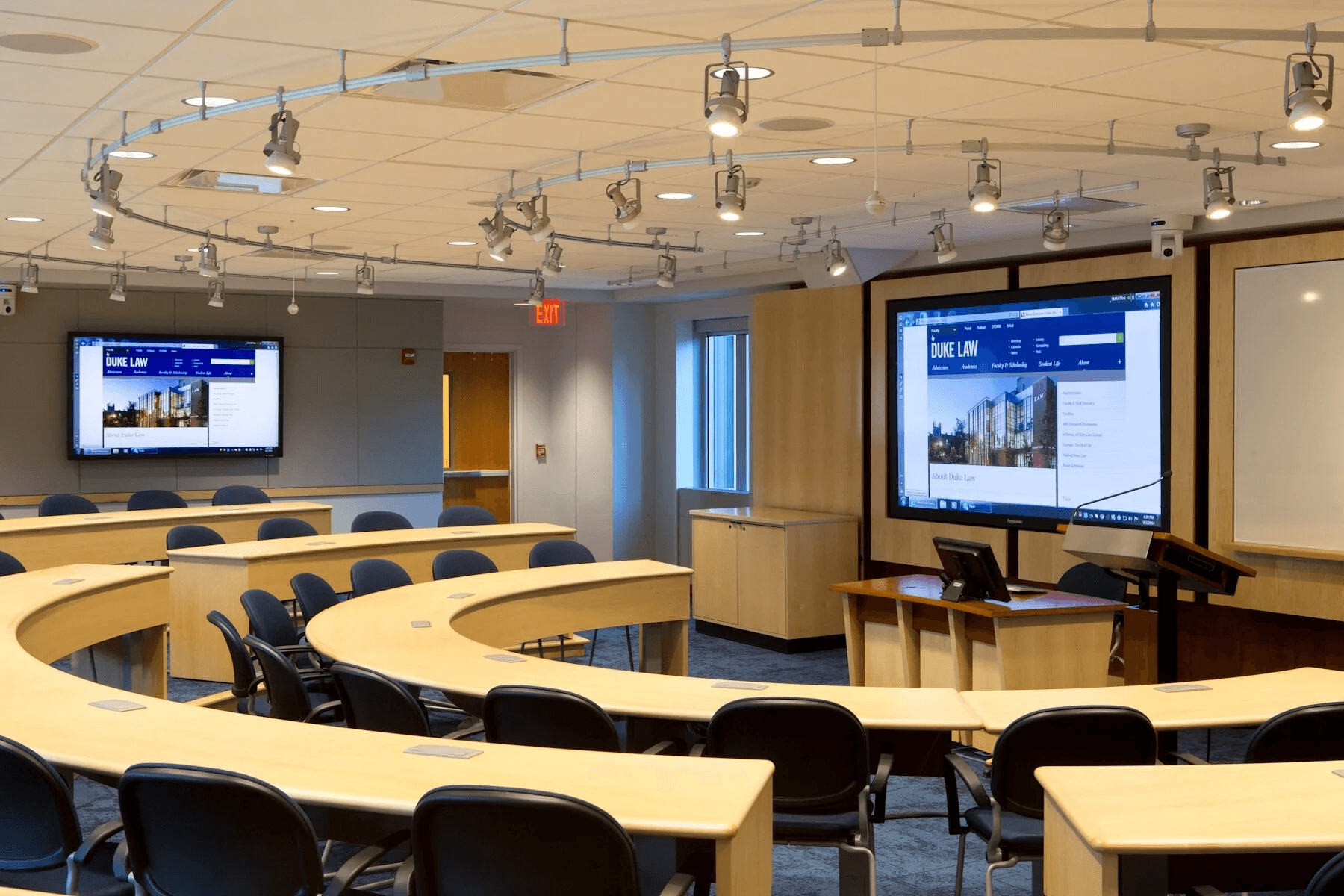 people sitting on chairs watching a game