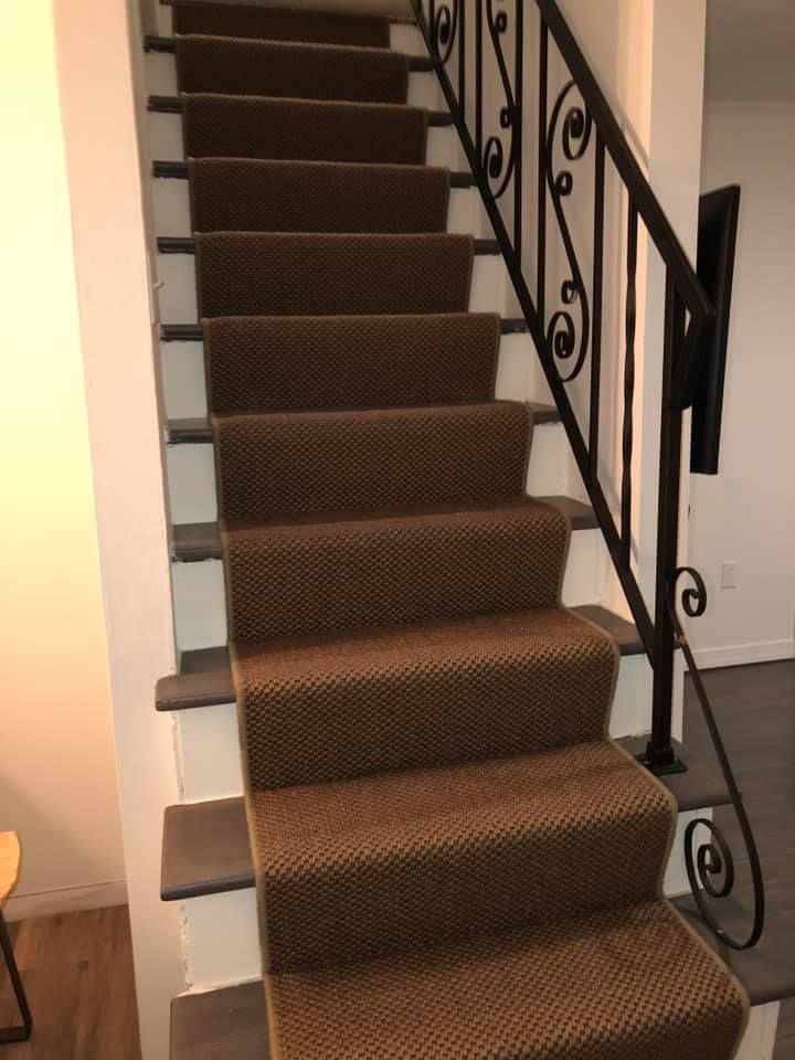 Custom carpet runner installed on a staircase