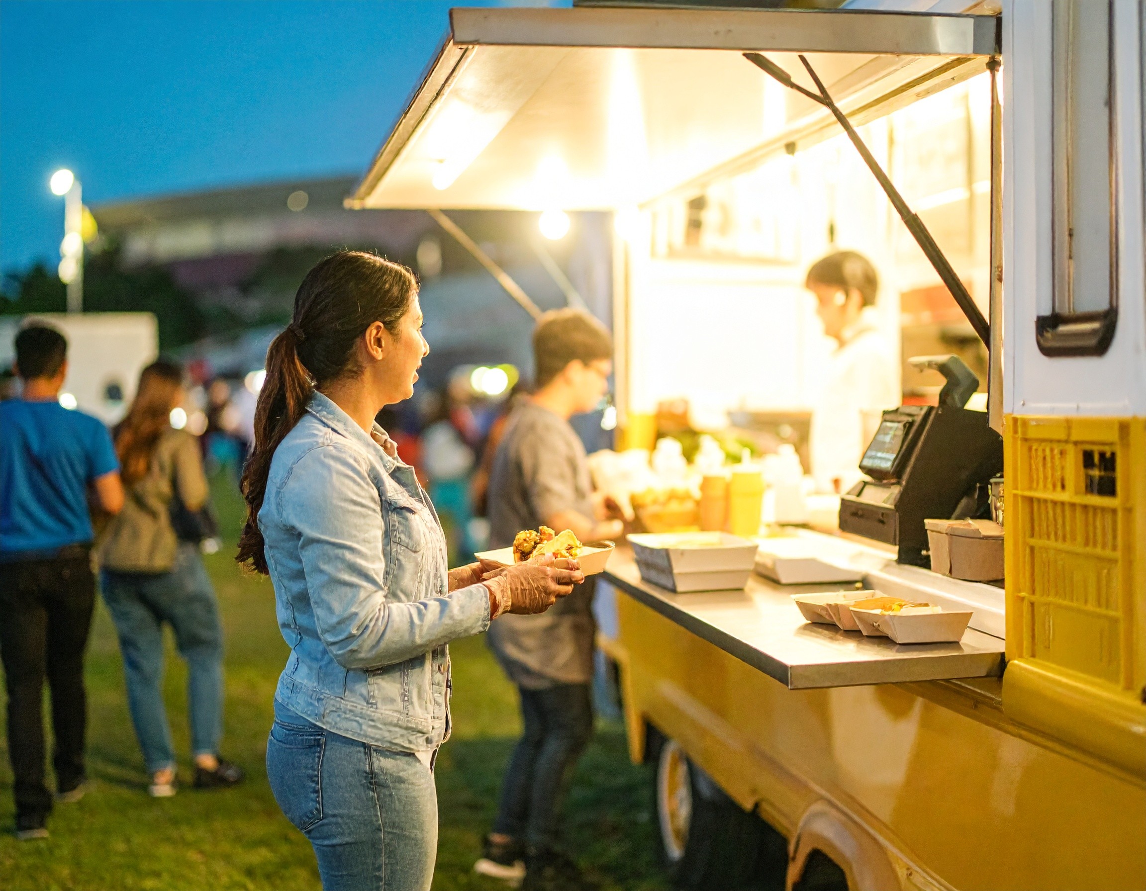 woman ordering at a food truck