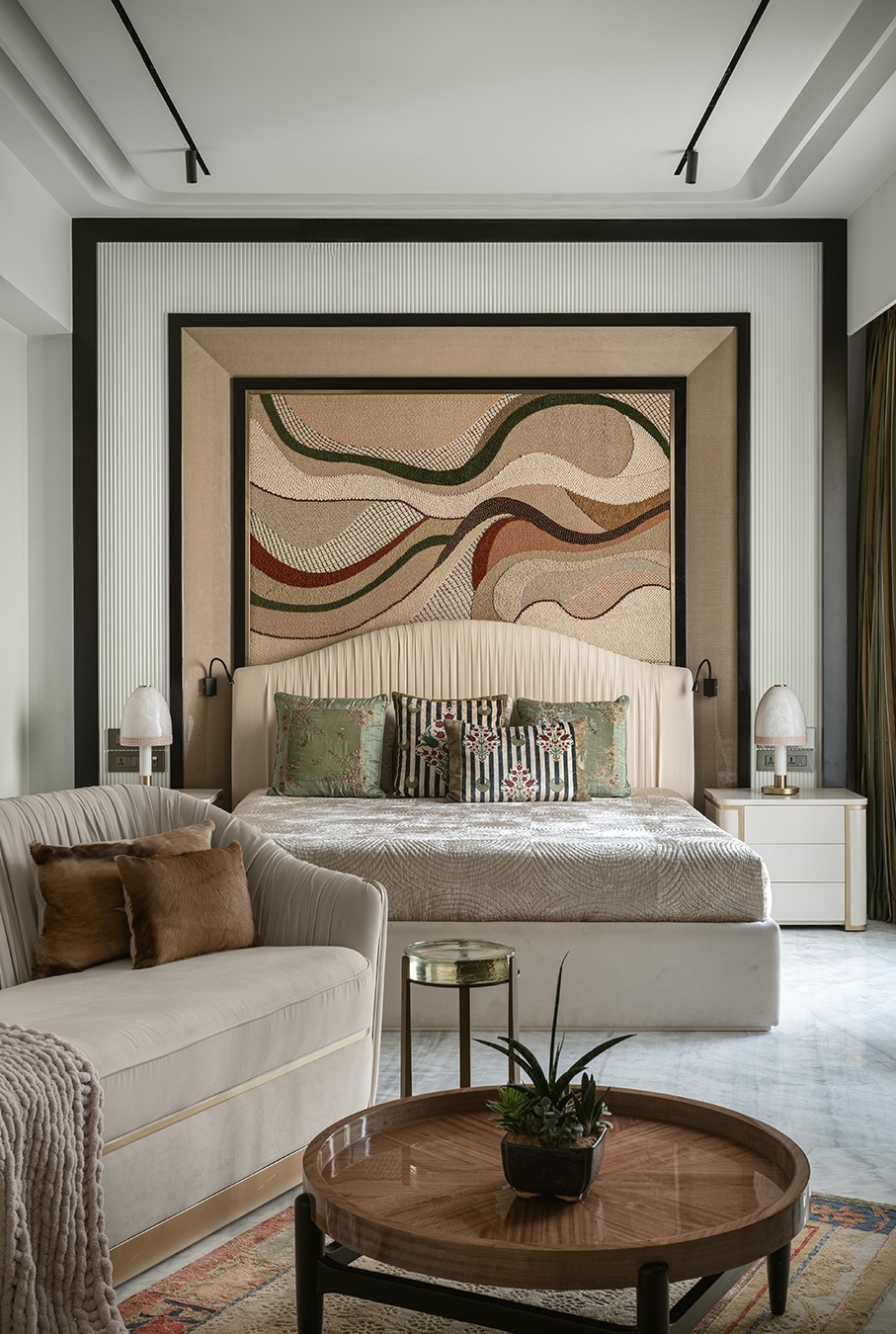 Minimal cream sofa set with cacti and skylight.