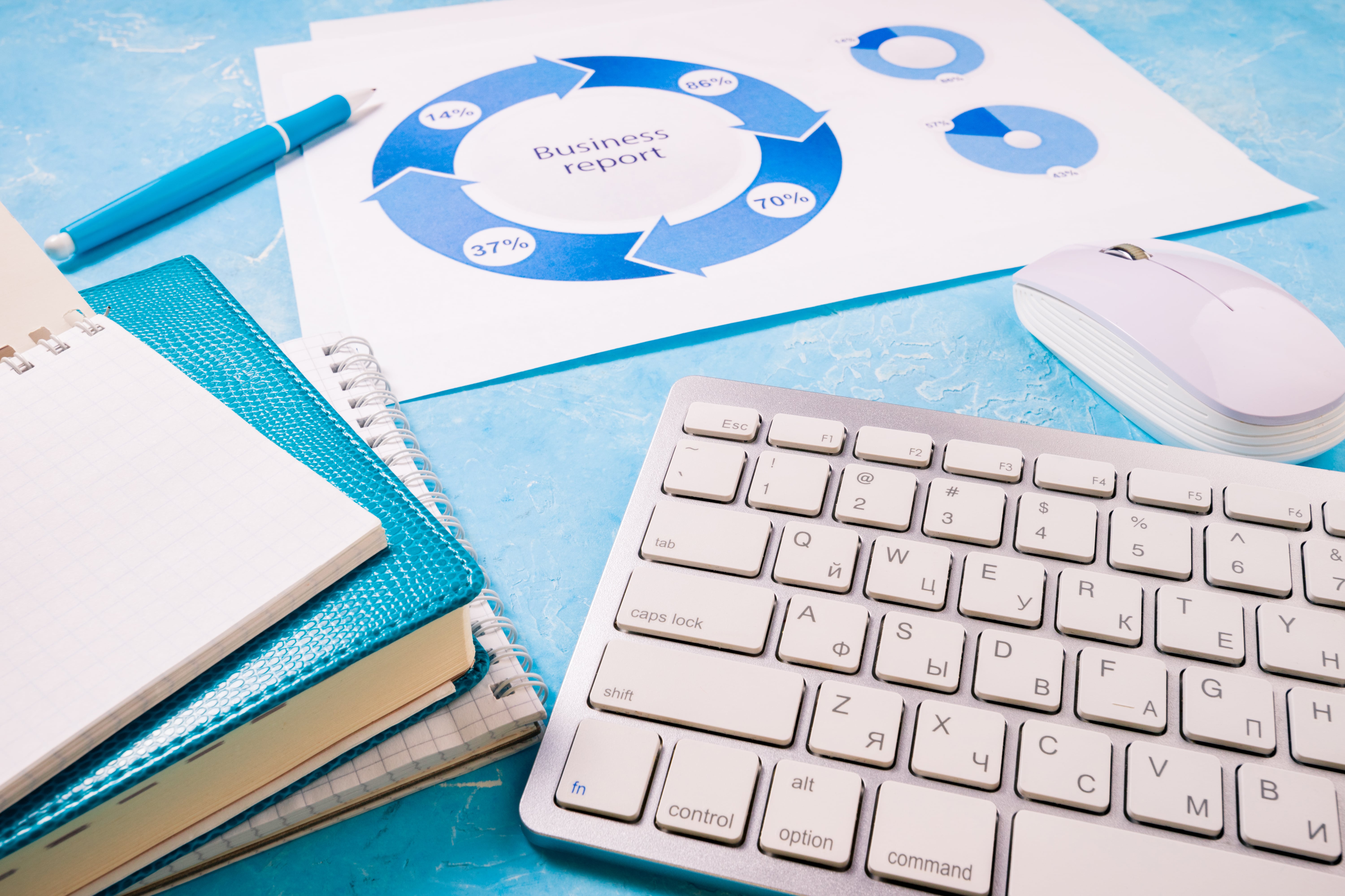 SEO strategy diagram on paper with keywords like optimization, backlinks, traffic, and content, placed on a wooden desk with coffee cup, pen, and smartphone – digital marketing planning concept