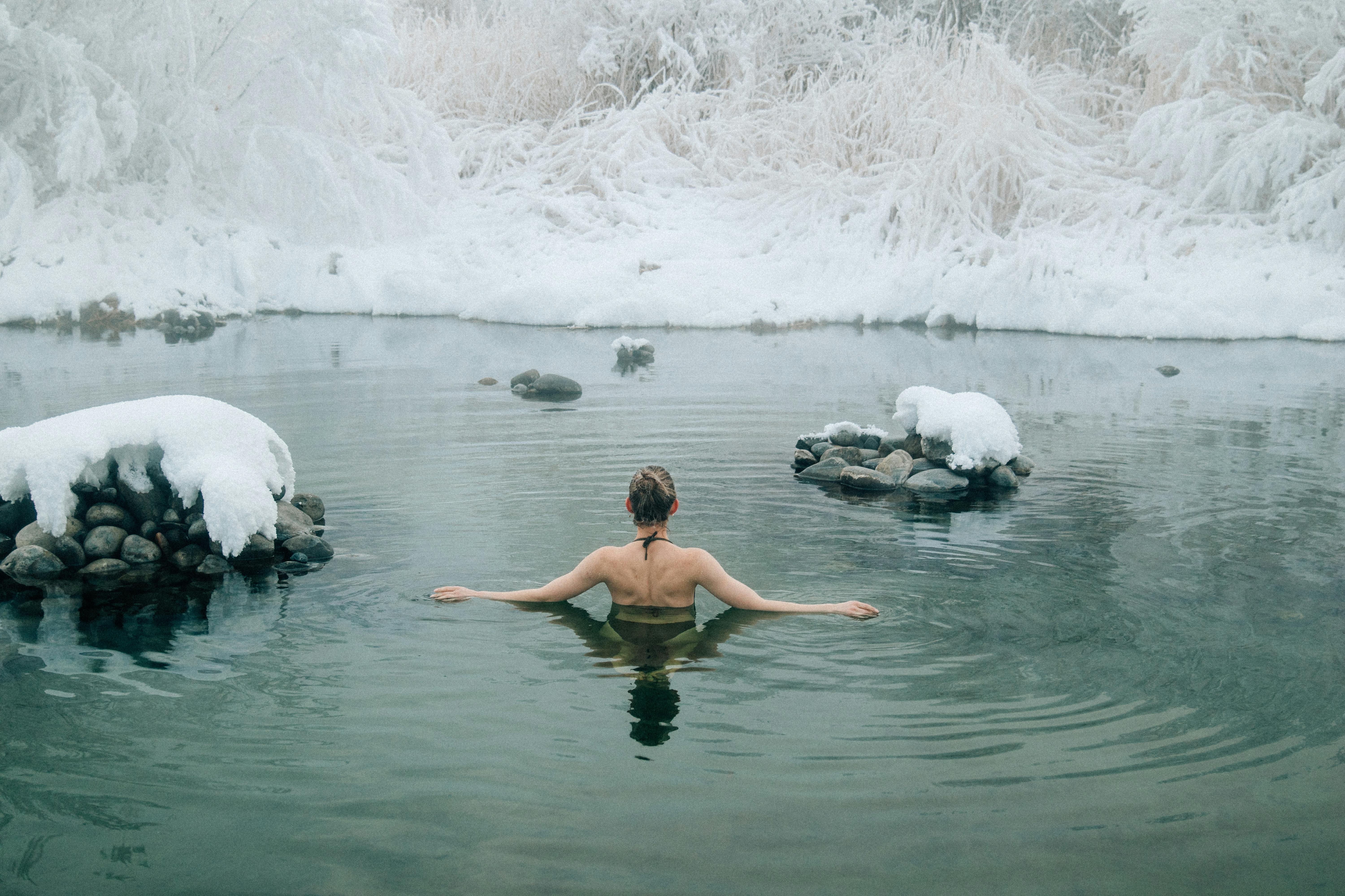 a woman bathing in hot springs