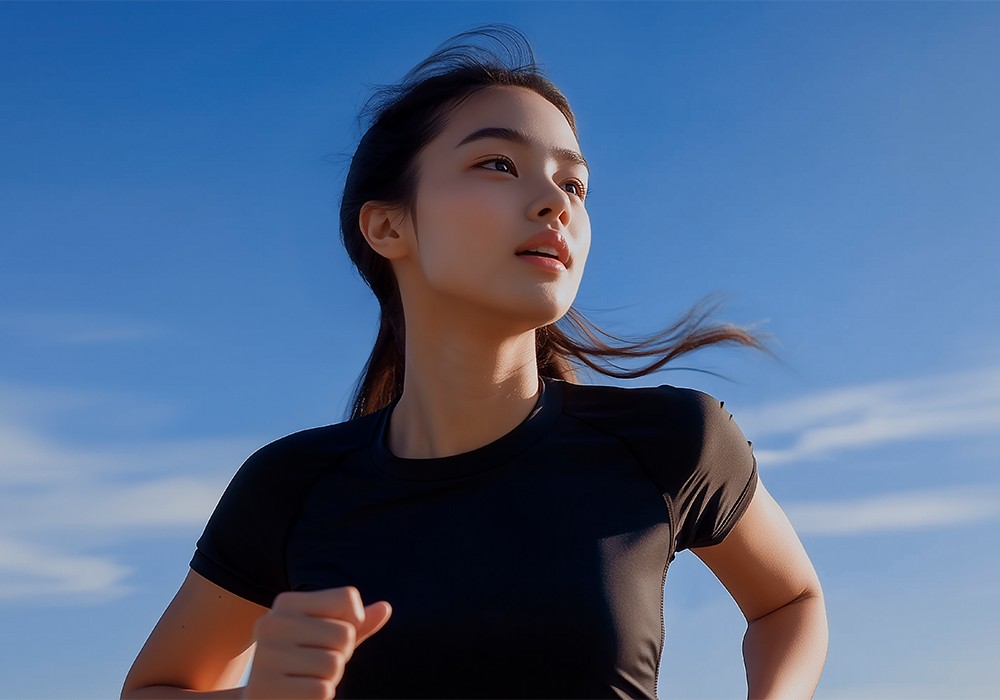 Woman jogging outdoors under blue sky