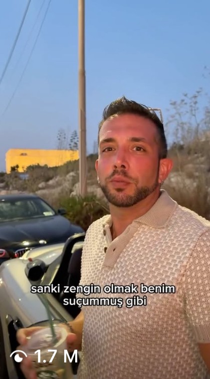 outtake from viral Instagram reel. igaming streamer standing outside looking at camera.