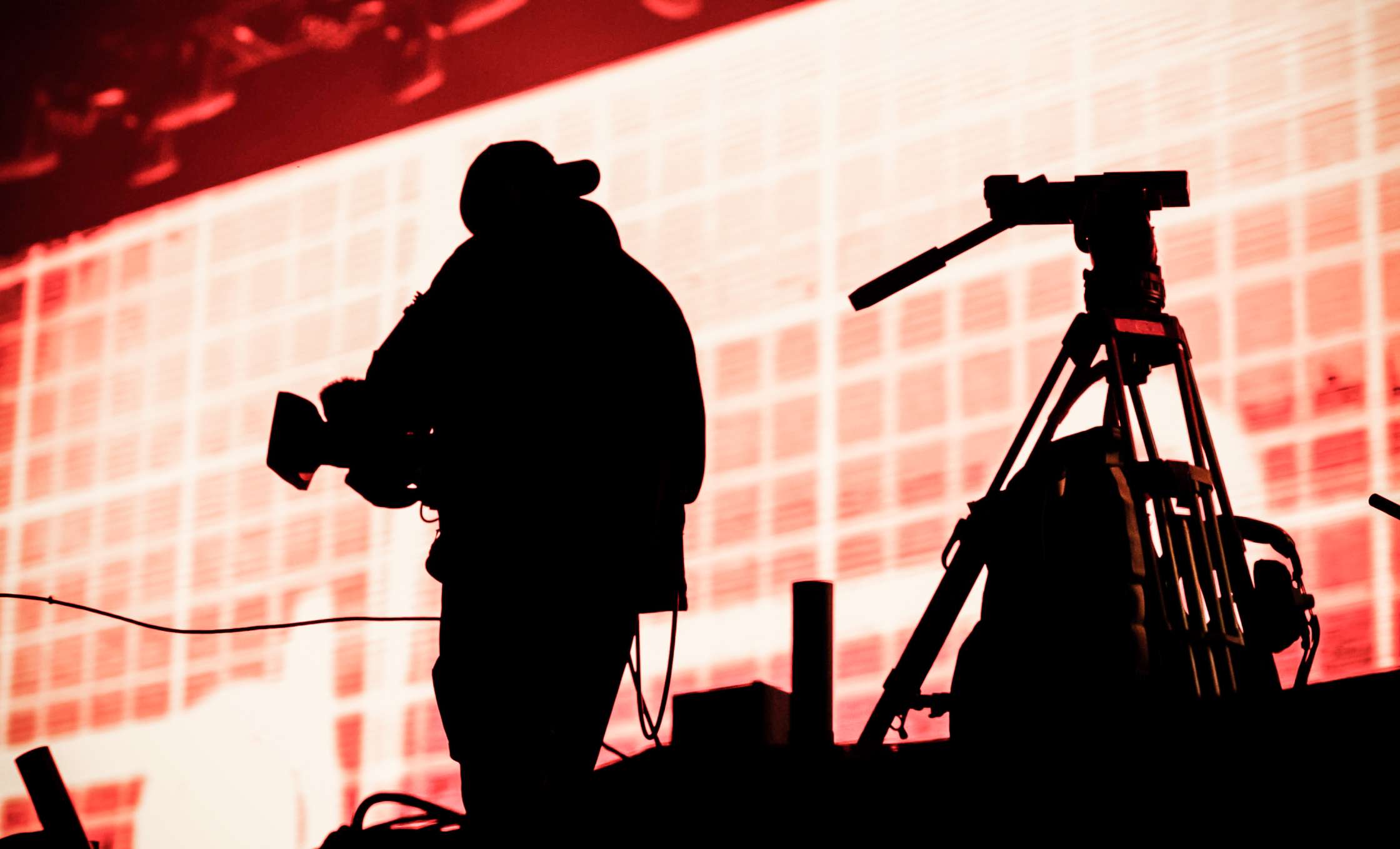 cameraman silhouette in stage lights