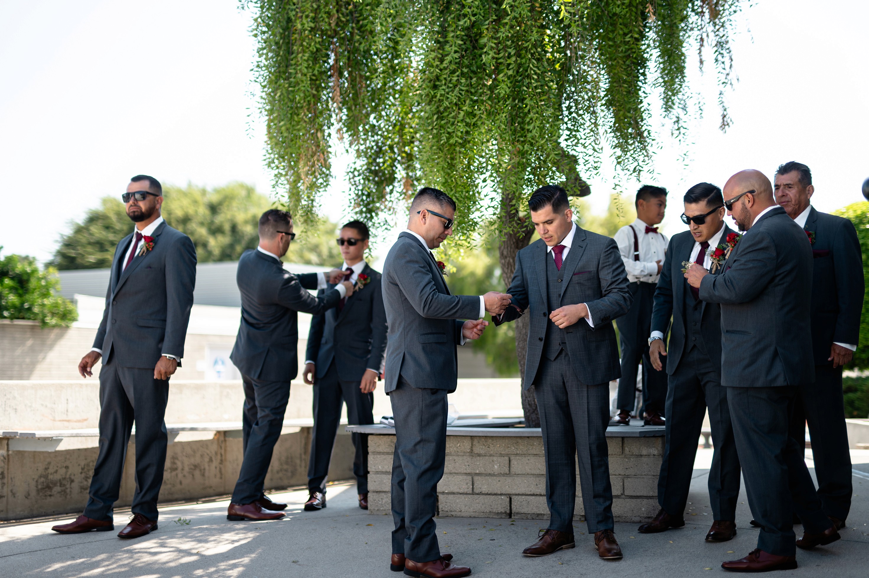 Flat lay wedding details with bouquet, rings, and sparkling bridal heels