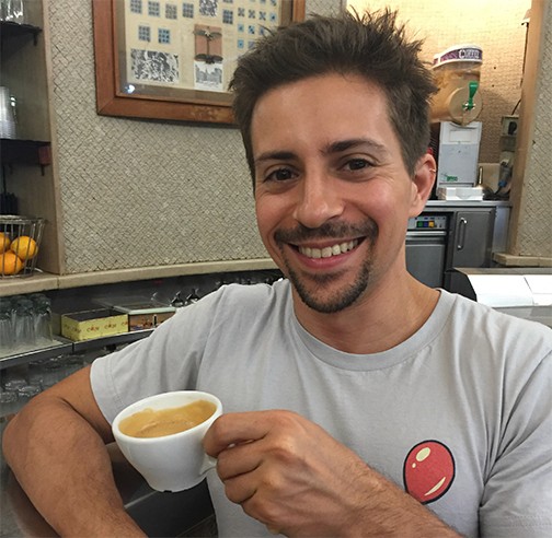 man holding coffee cup