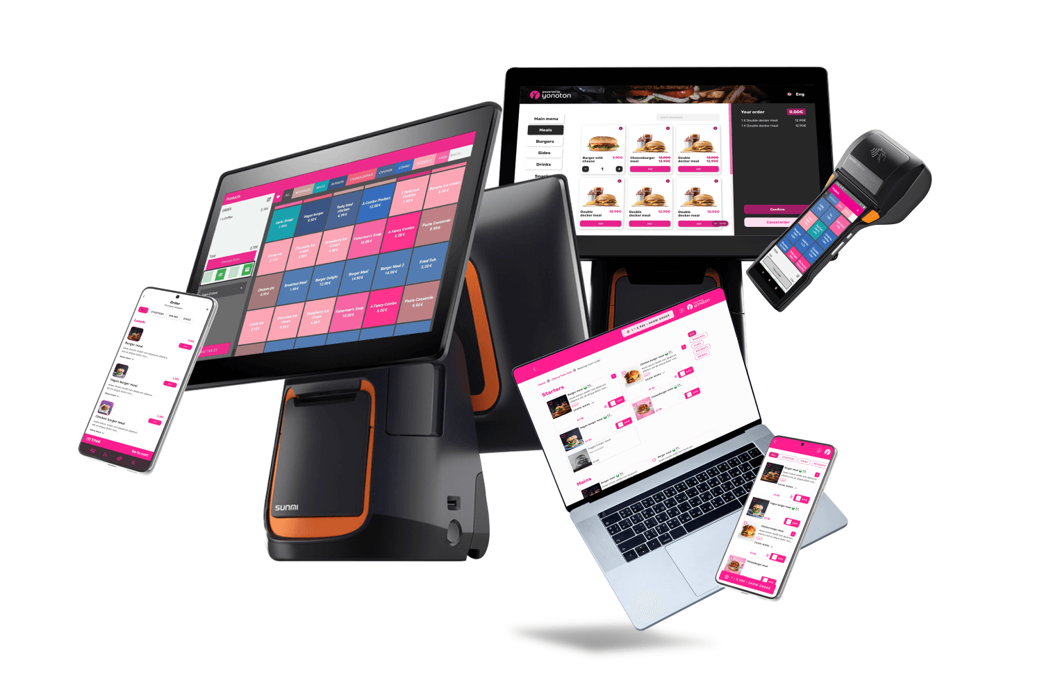 A young person with curly hair smiles at the camera while sitting in front of a laptop against a dark background.