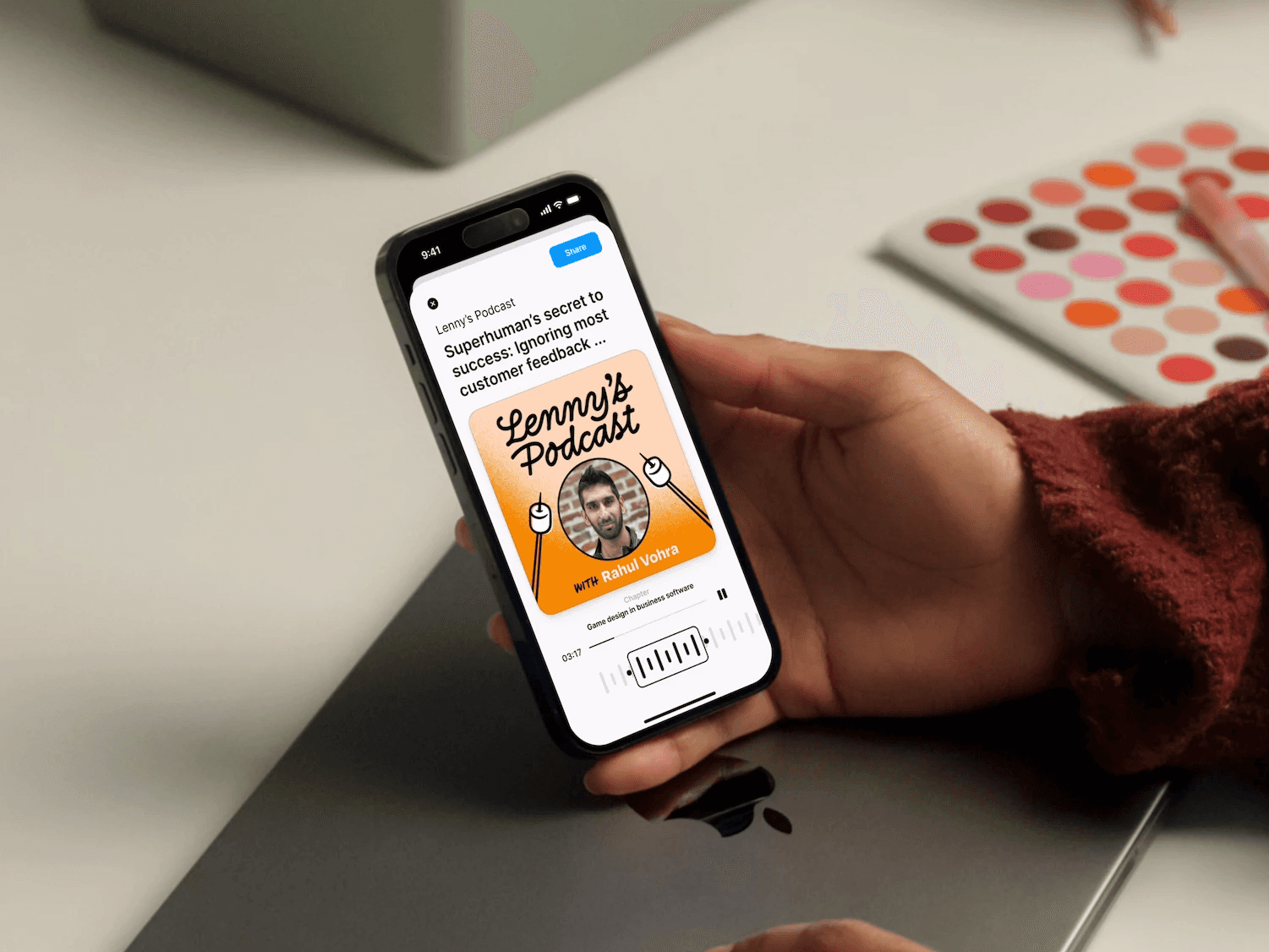 Man holding phone on Queue App