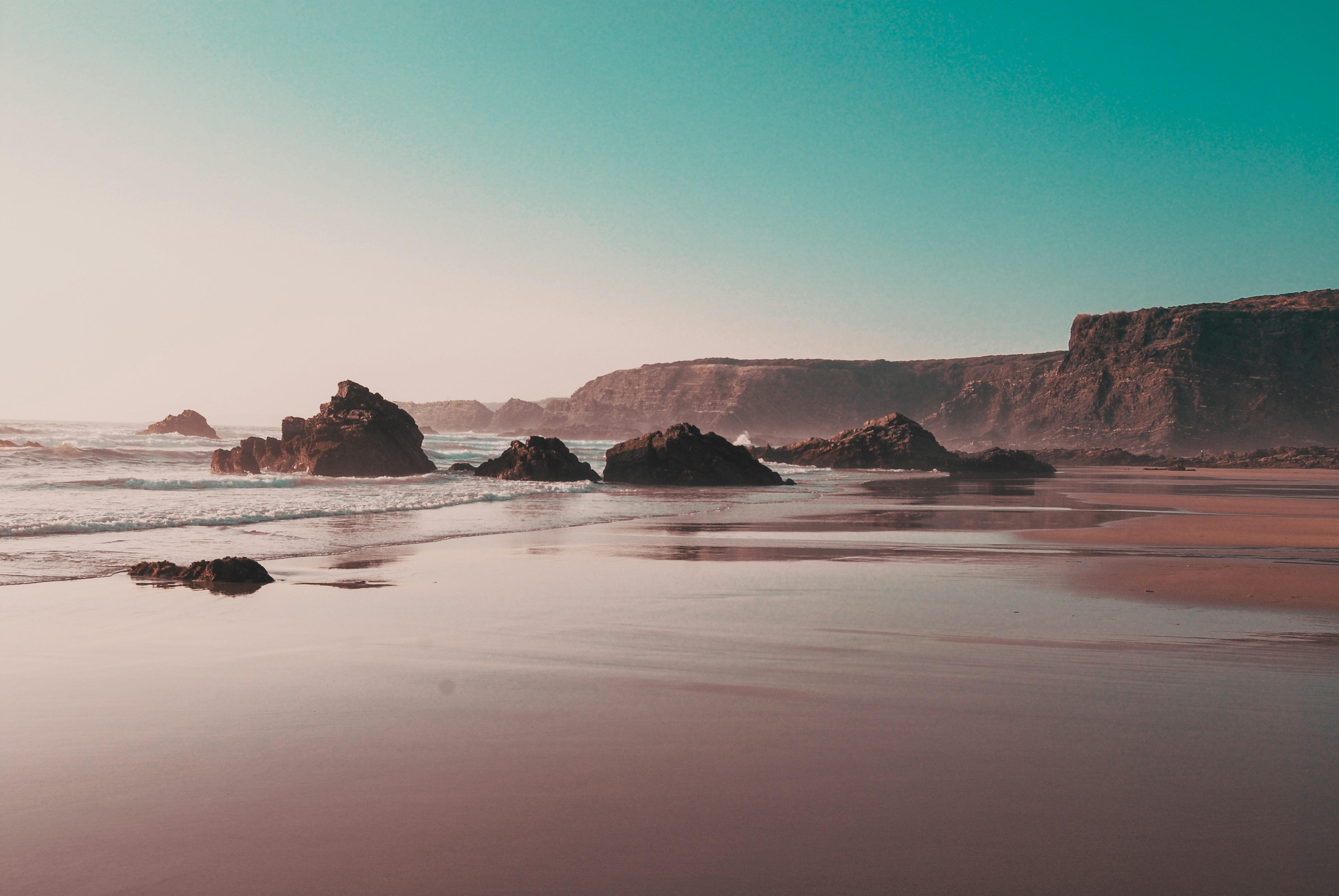 Rocky beach with distant cliffs