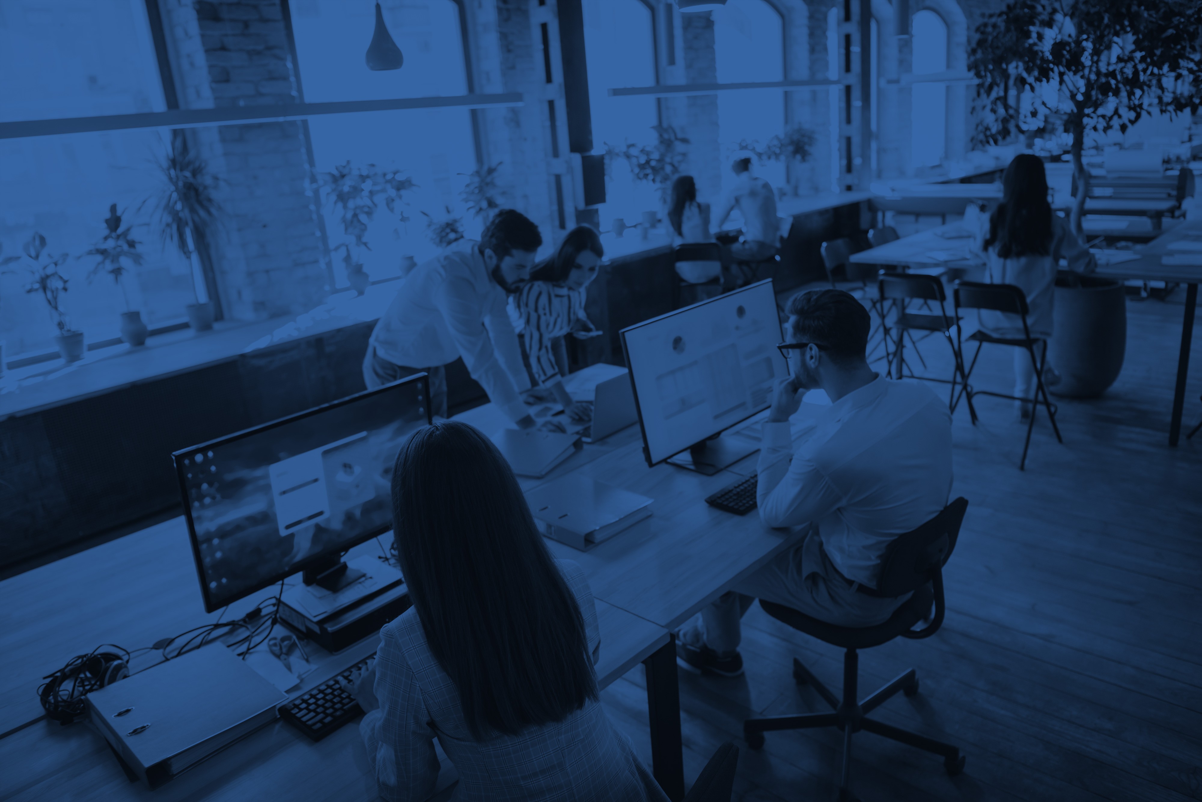 Team working in an office watching at a presentation