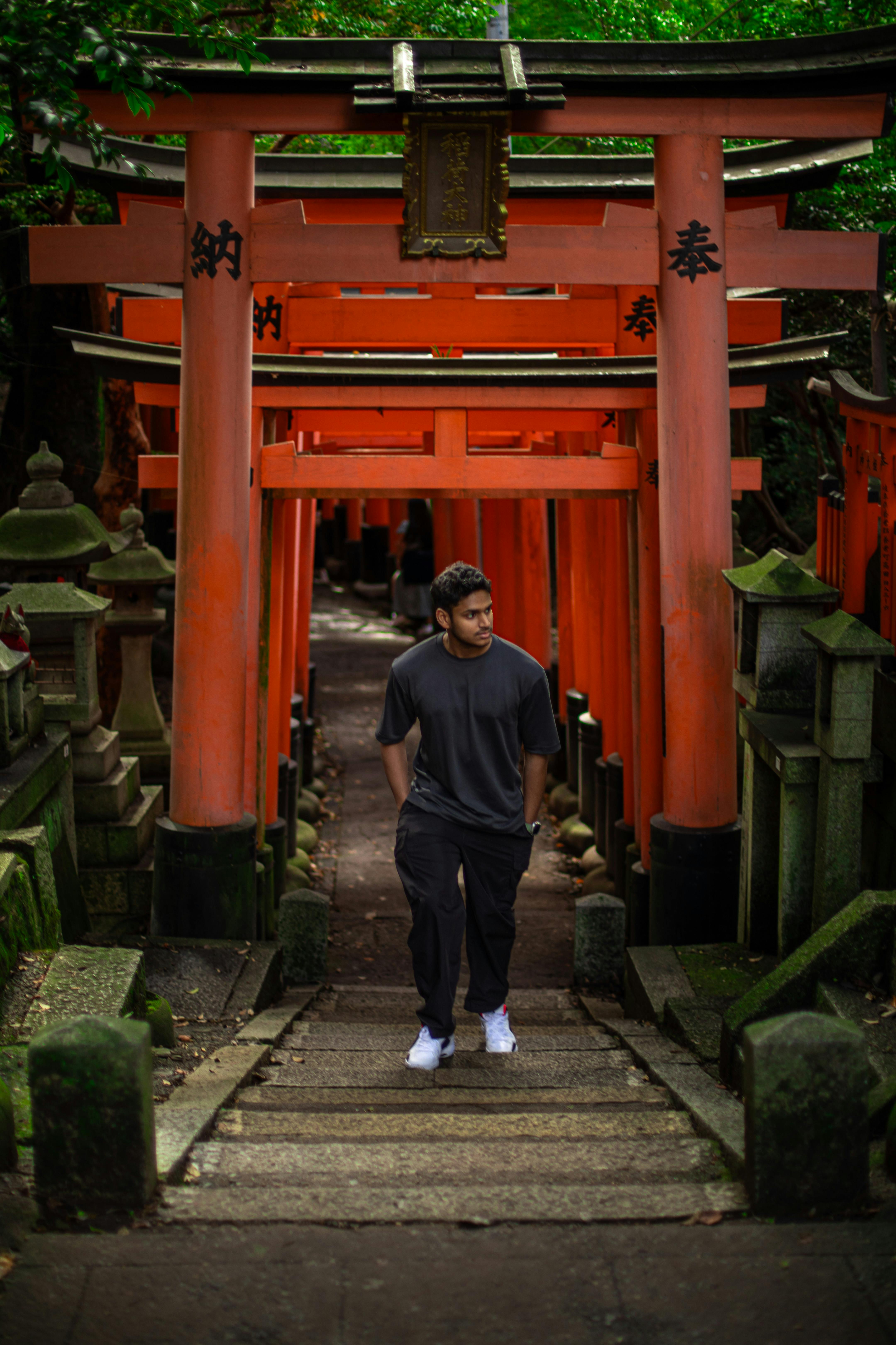 Close-up of a dark green leaf showing its textured surface and central vein against a muted background.