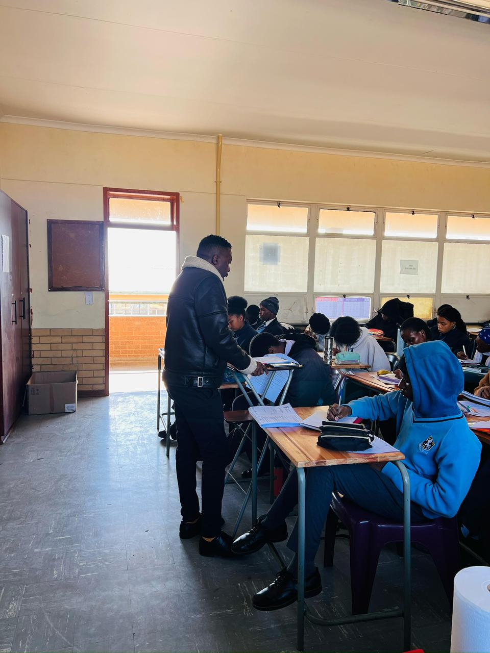 people sitting on chair in front of laptop computers