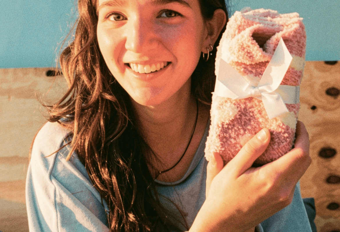 A wrapped gift with a gold ribbon — the whole point of a wishlist