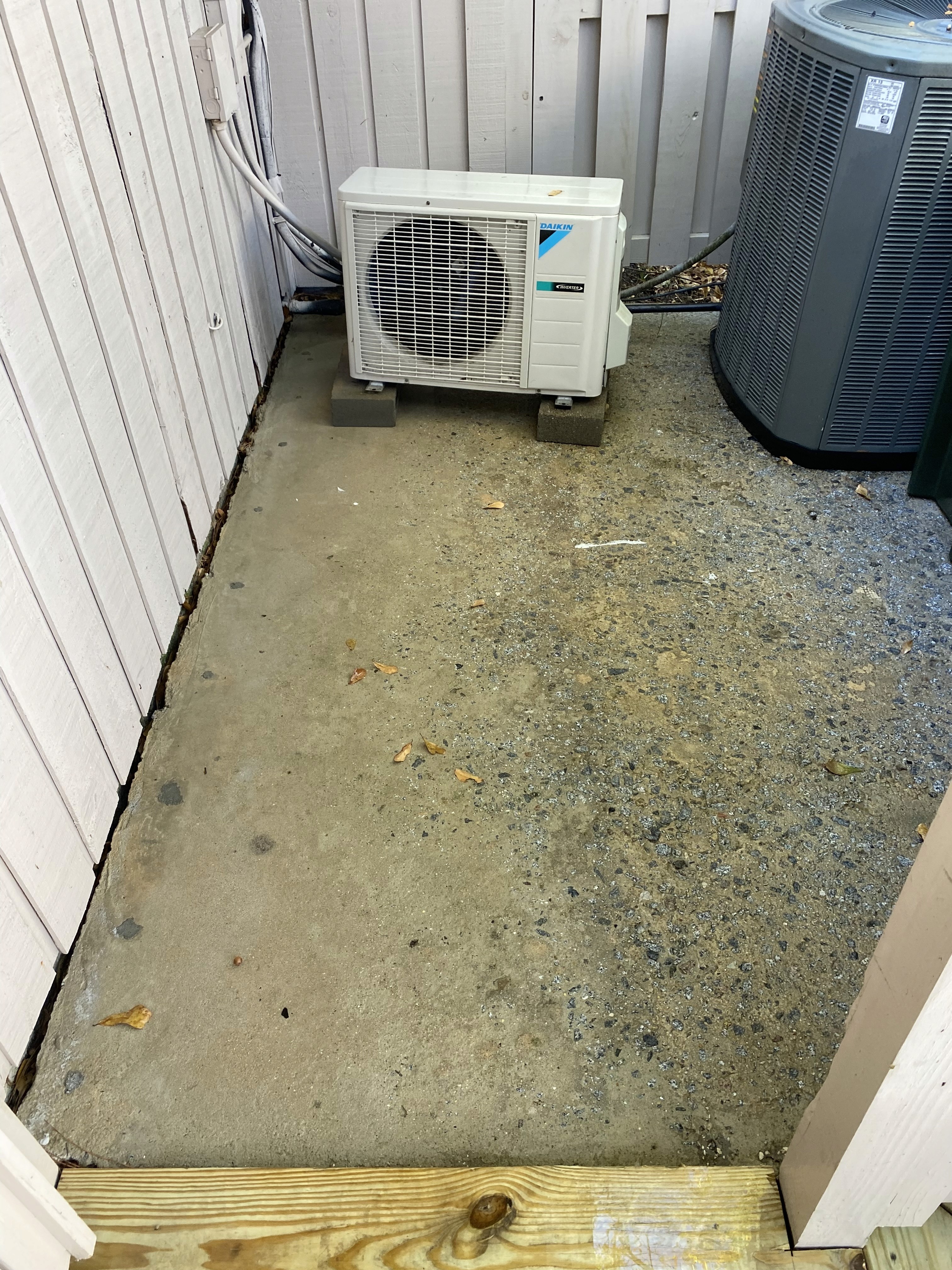 Before and after—home siding soft washed, surface free from algae and grime