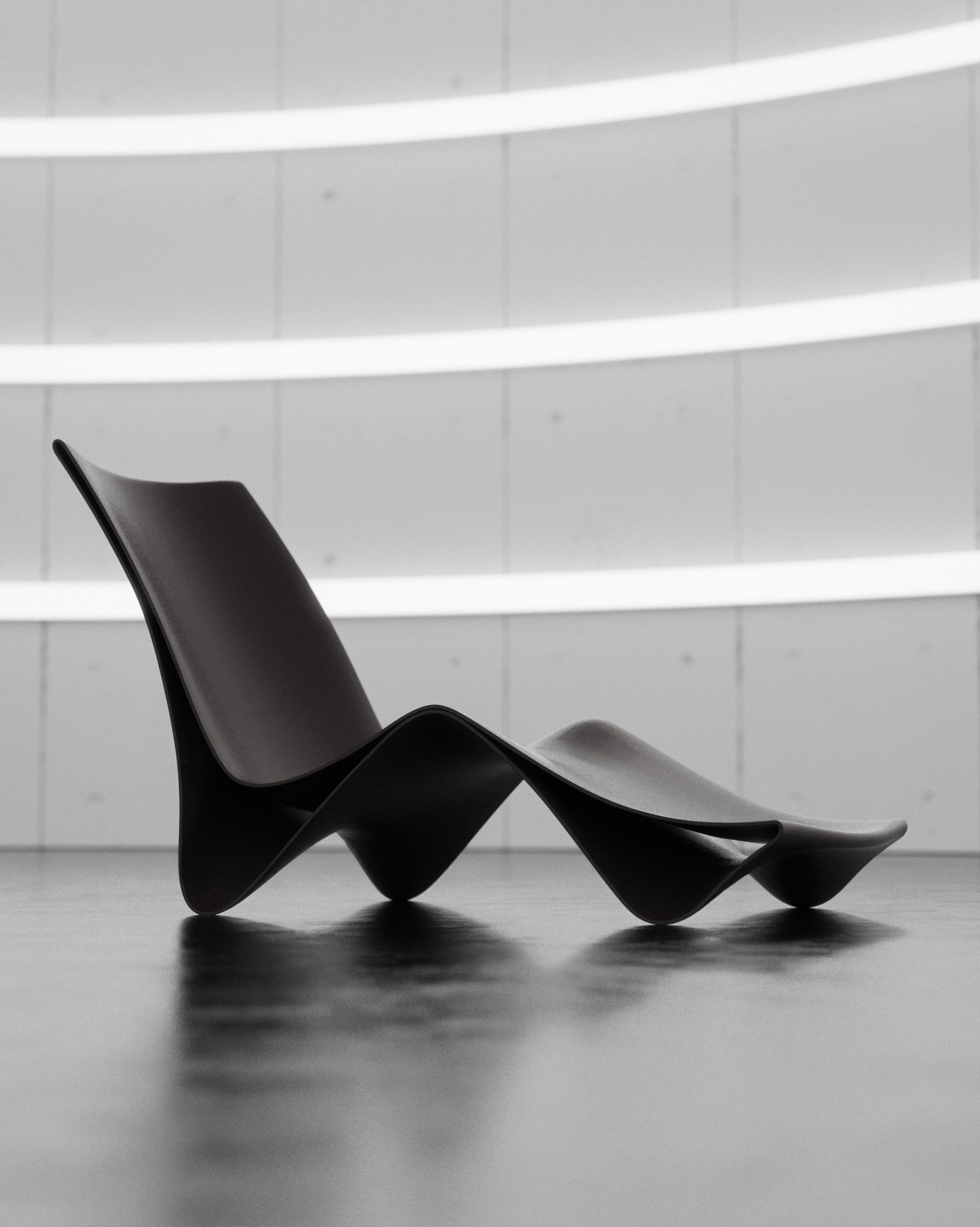 Dramatic moody curves of the Curva Chaise Lounge Chair designed by noknok studio