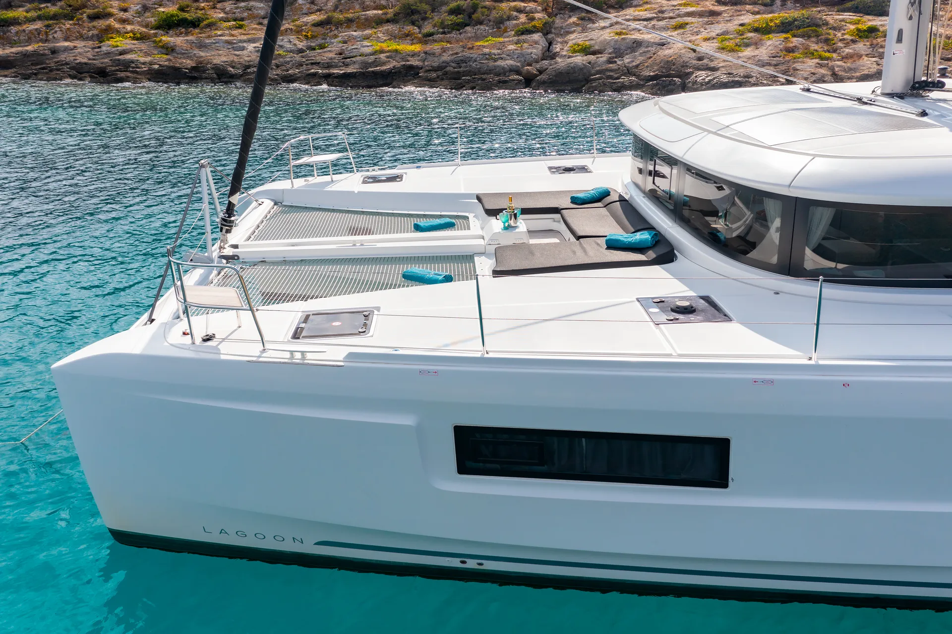 White Rock 36 speedboat with captain at helm cruising calm blue waters near Paros coastline with hills in background.