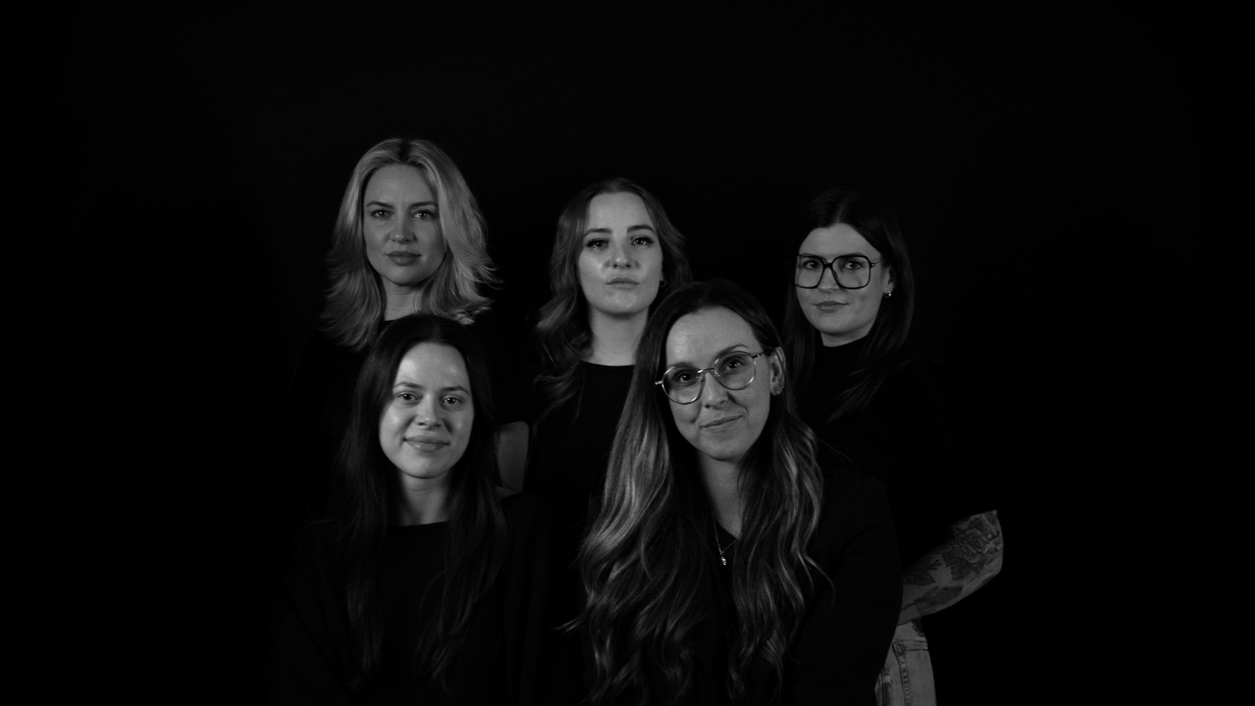 People celebrating, red stickers floating in the air