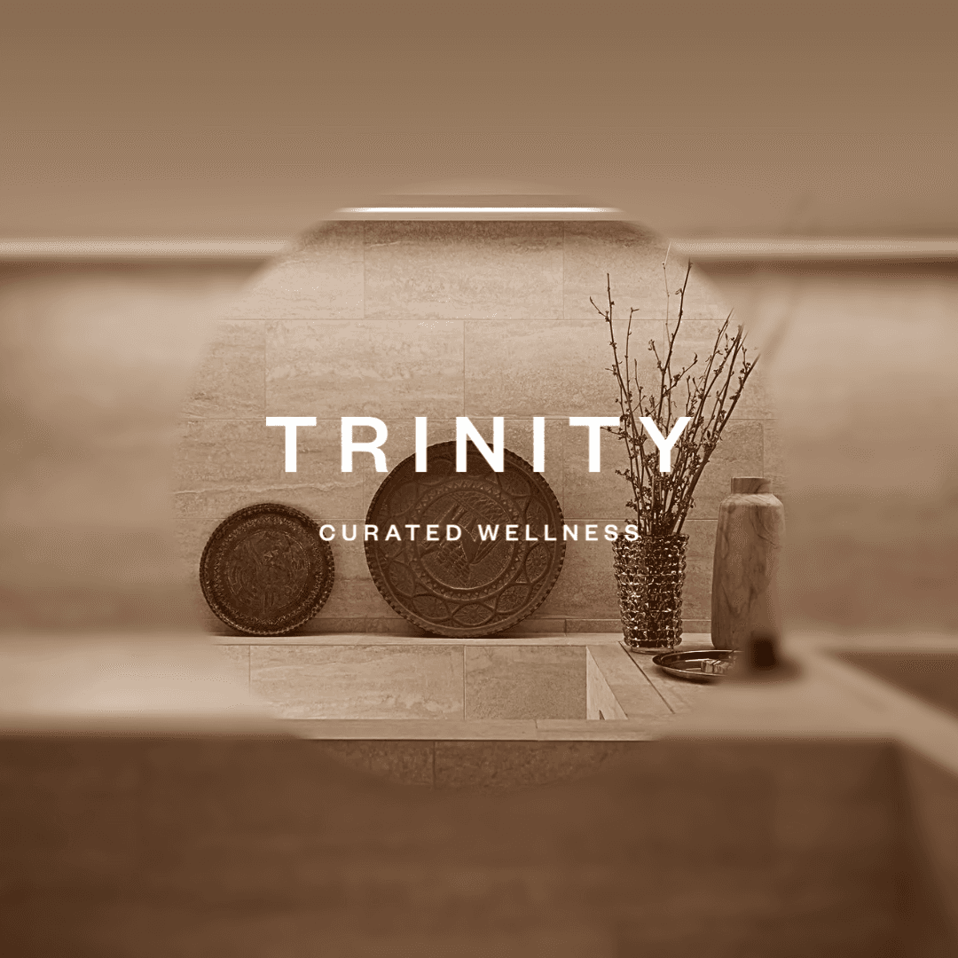 Burning incense in a stone bowl beside a pack of incense, all resting on a unique, patterned mat.