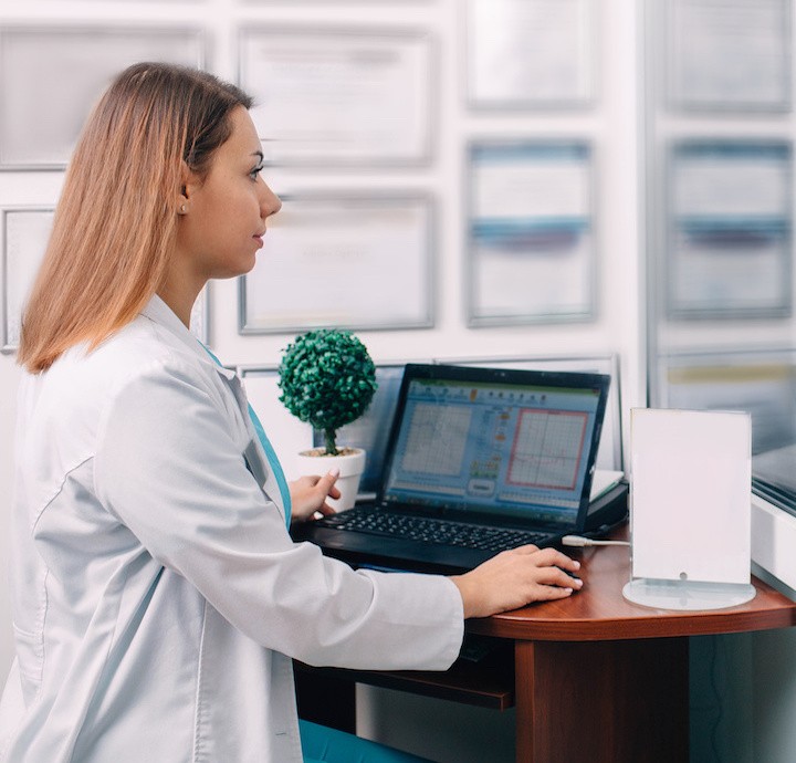 Hearing specialist sat at a desk