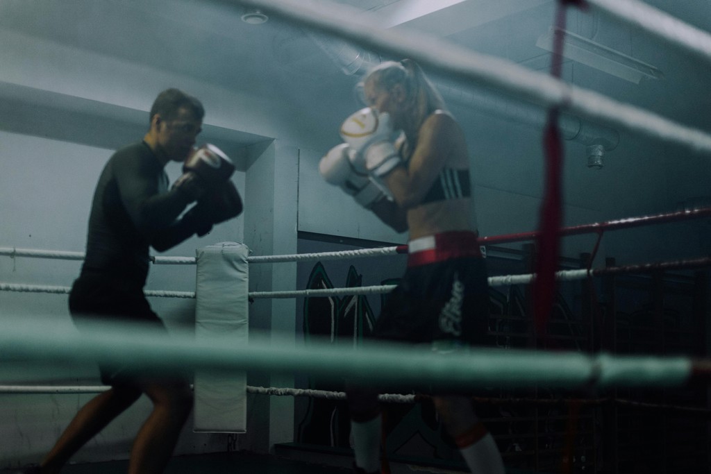 two-boxers-sparring-in-a-dimly-lit-boxing-ring,-showcasing-skill-and-strength. - koolshooters (pexels)