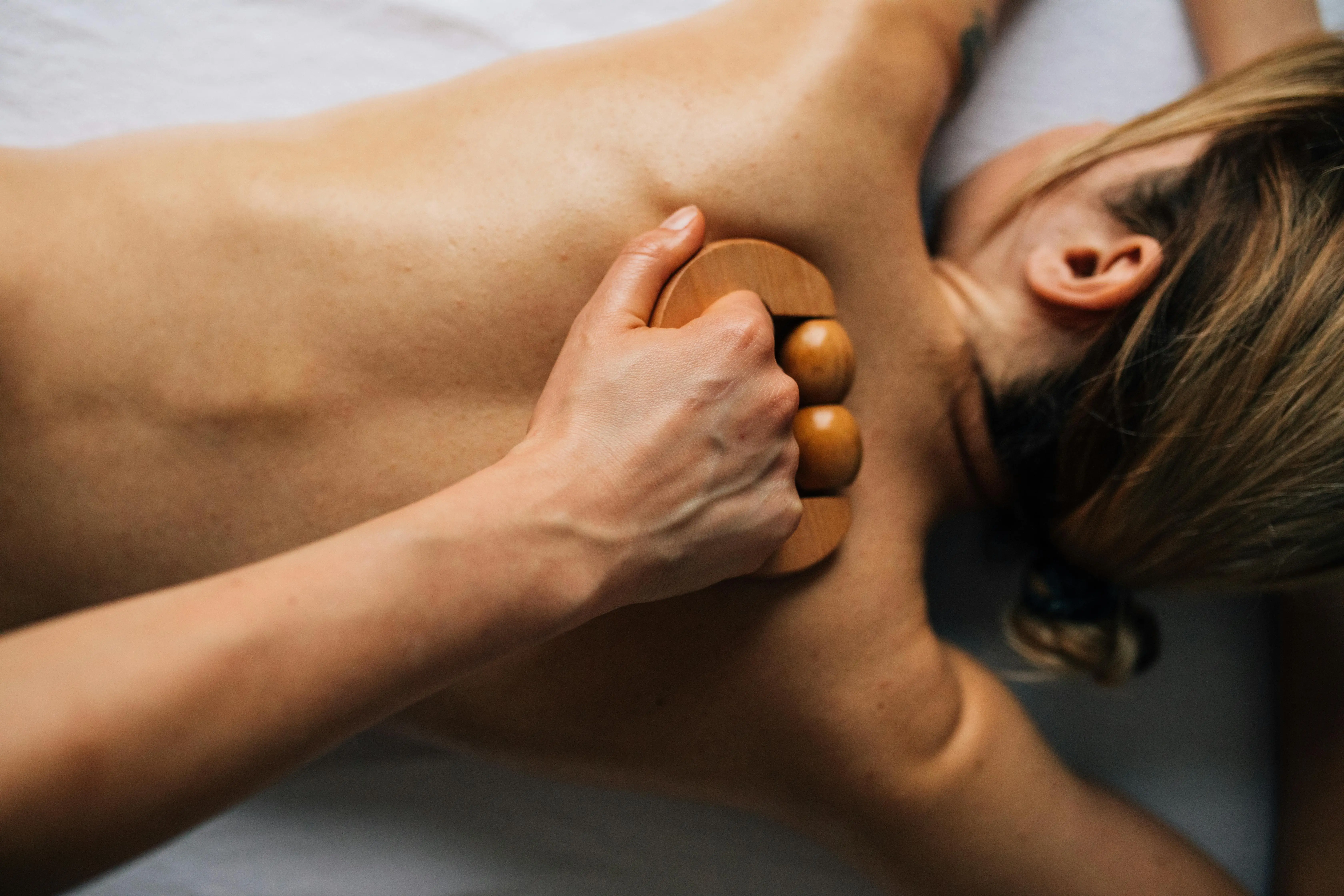 Woman gettingWood Therapy massage treatment