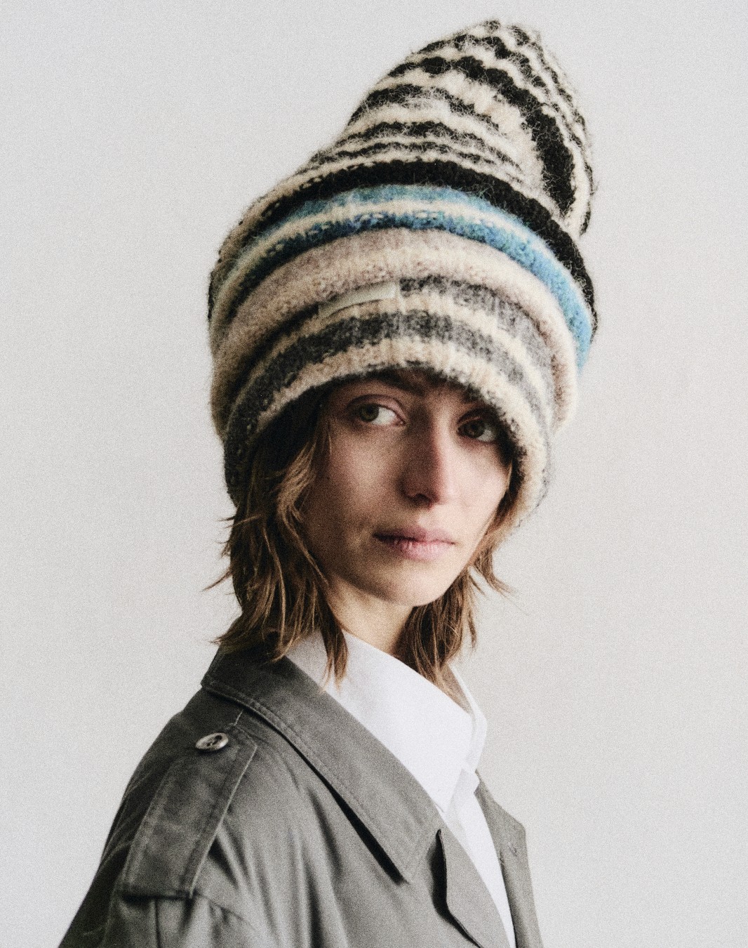 selective focus photography of woman with brown wooden wall background