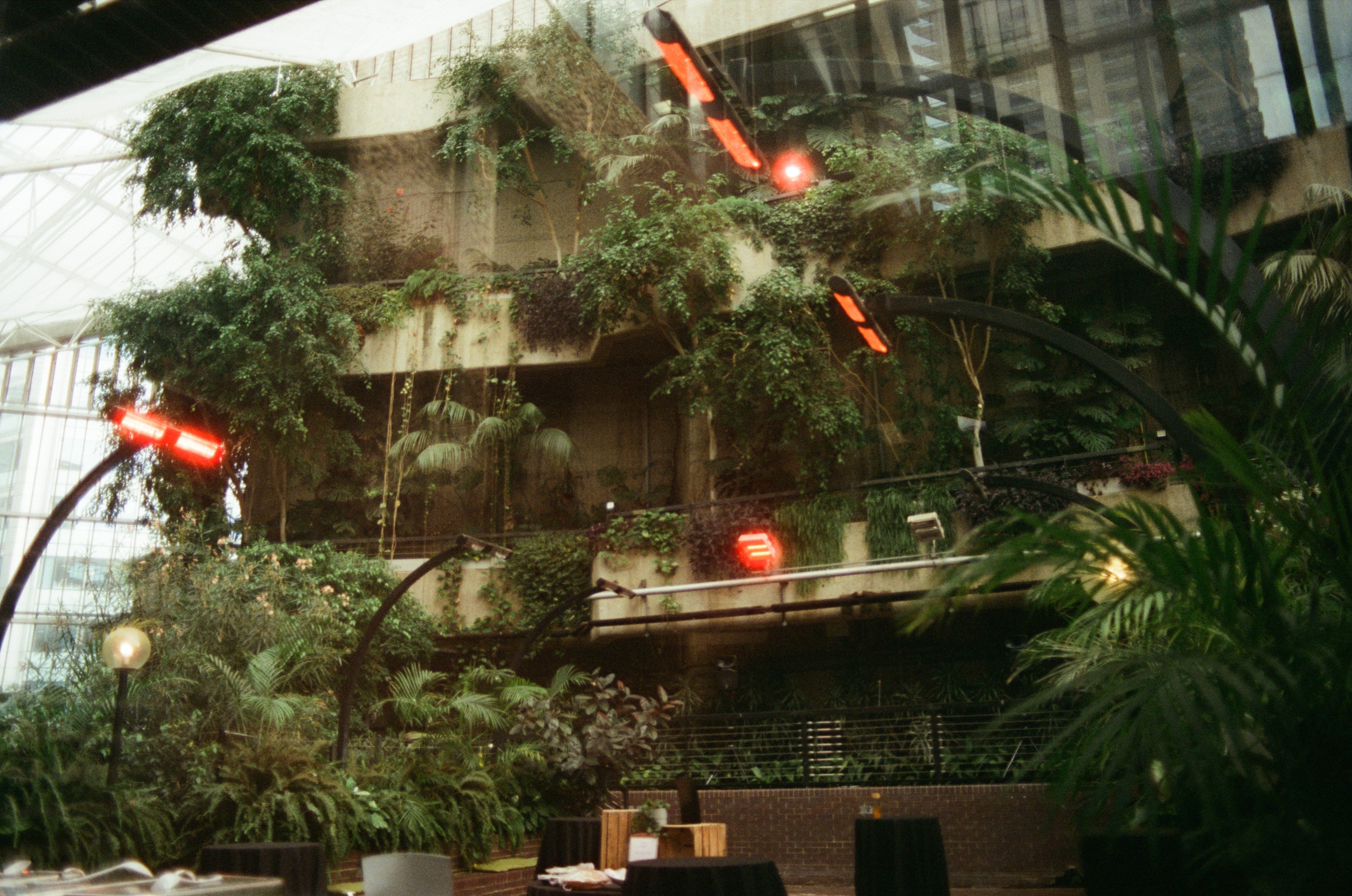 Modern skyscrapers line a busy highway in a sprawling city.