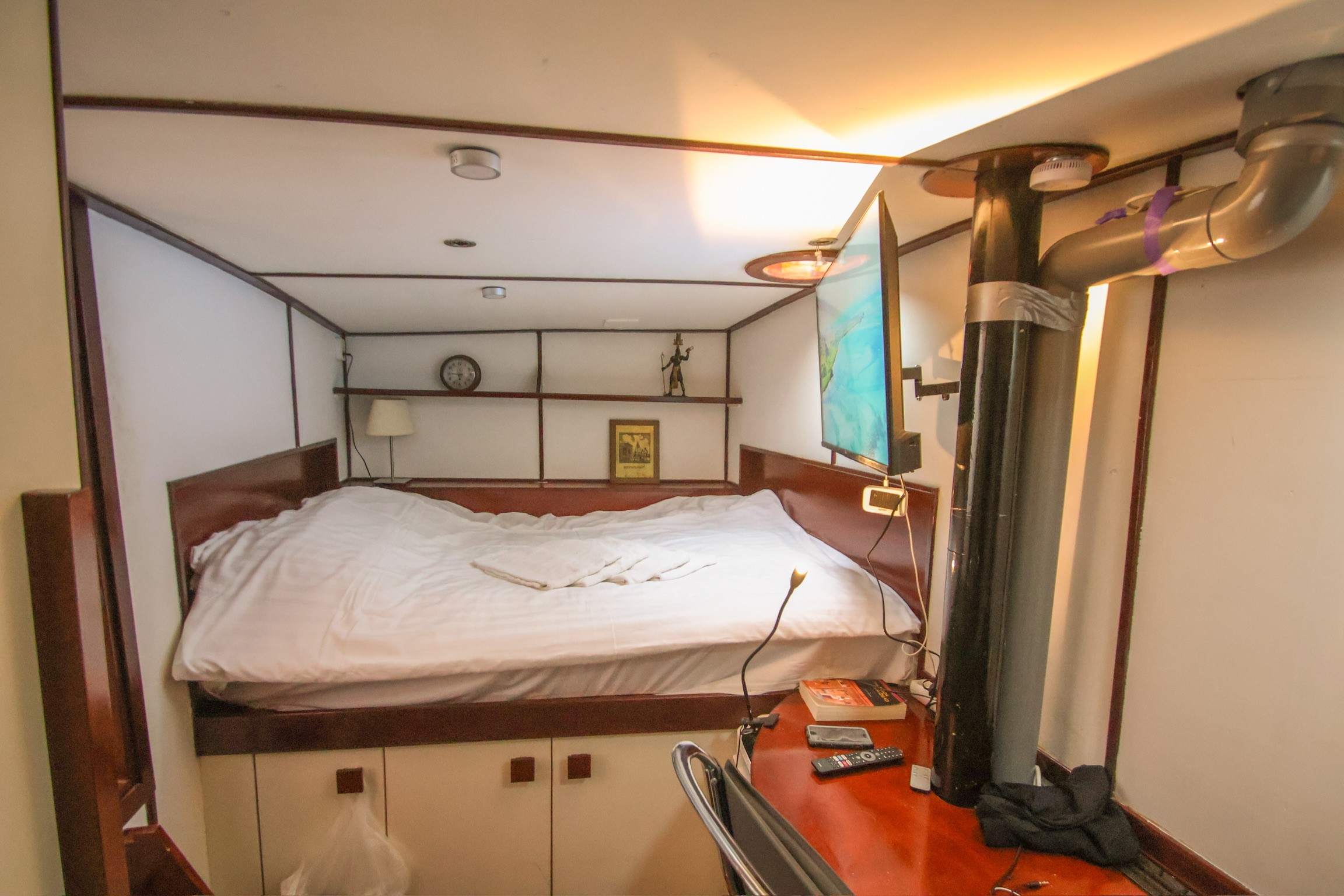 Modern office desk with angular design and leather chair