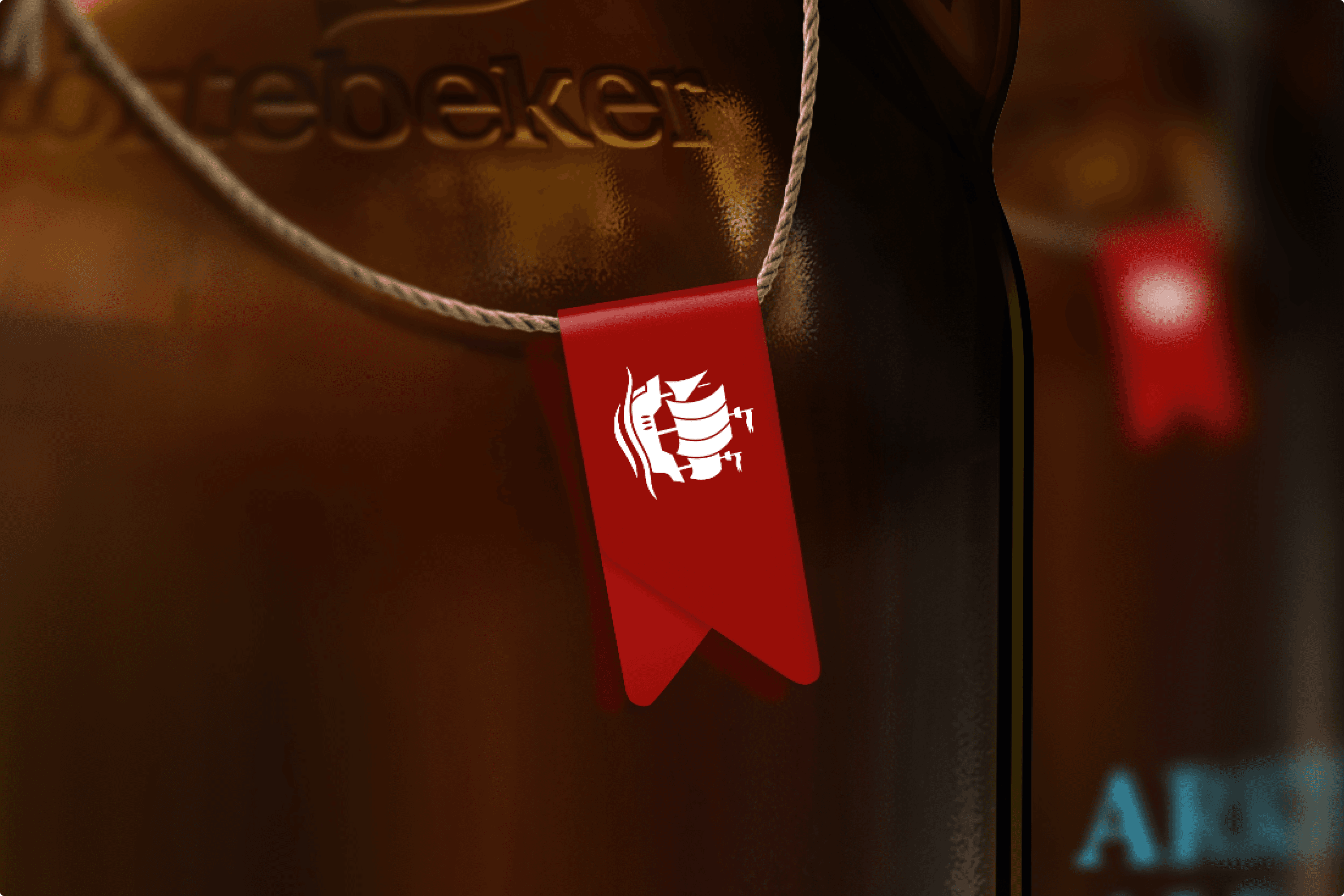 Red ribbon tag with white logo on rope.